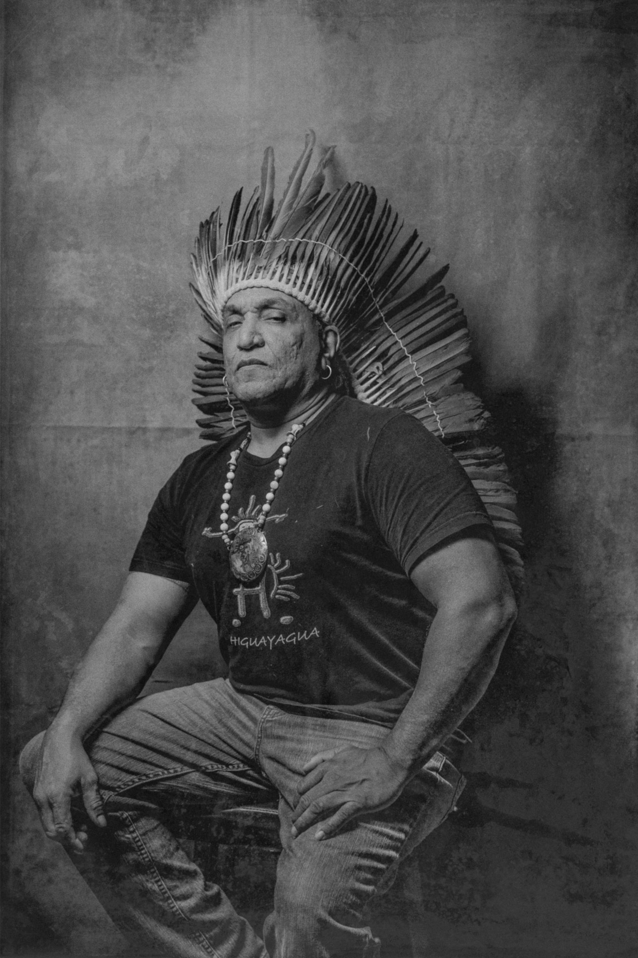 a Taíno person sitting for a portrait