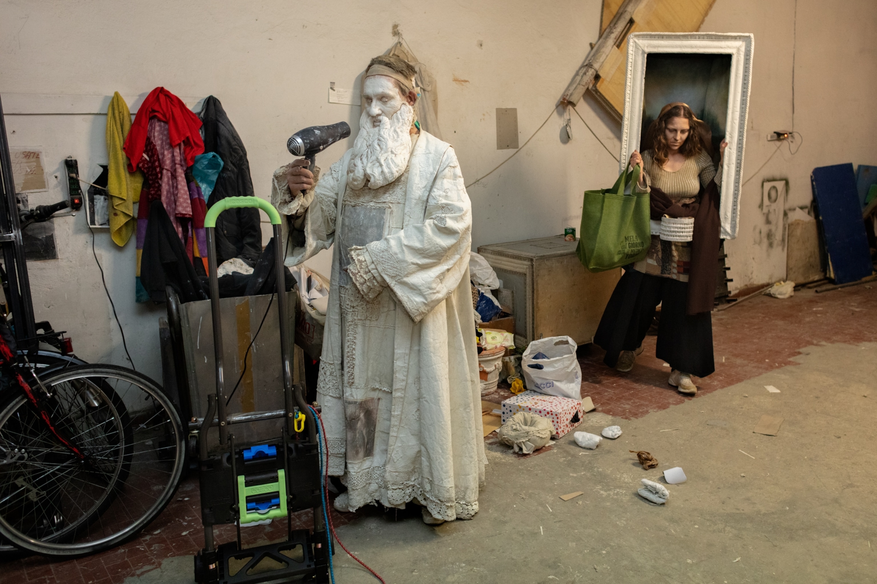 medieval impersonators getting dressed in costume