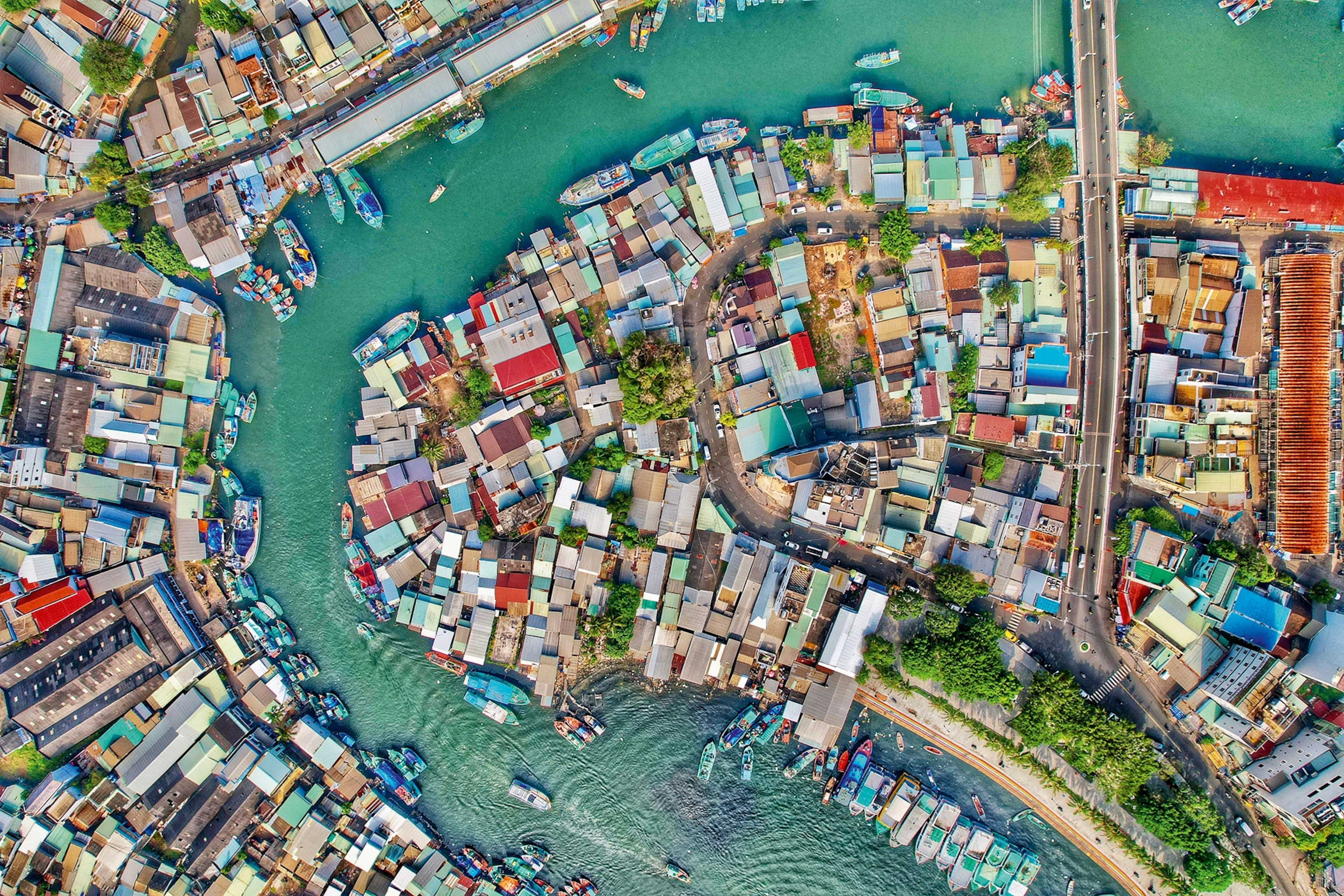 A birds eye shot of a Vietnamese island. The water is a turquoise blue.