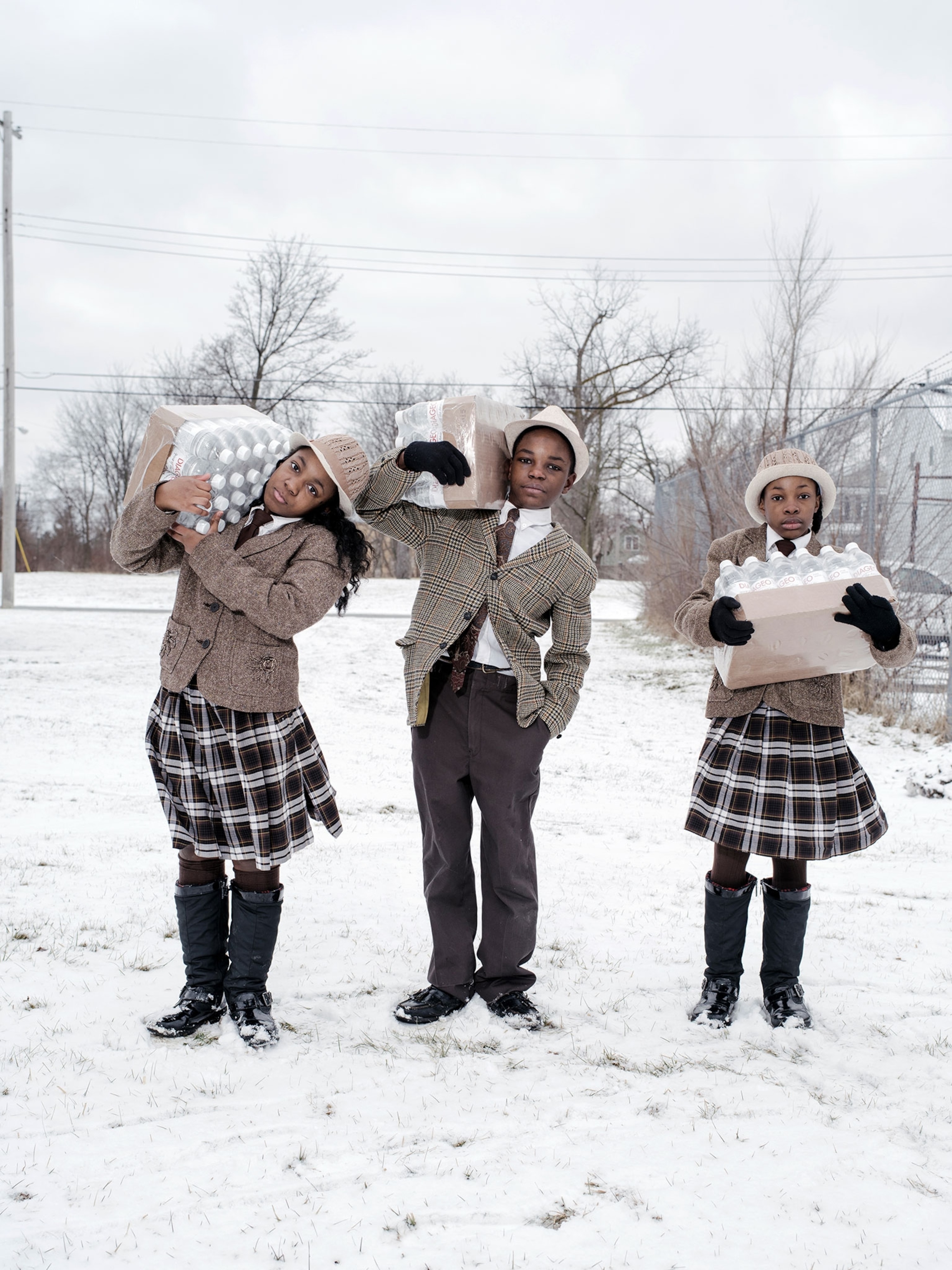 children carrying bottled water in Flint, Michigan