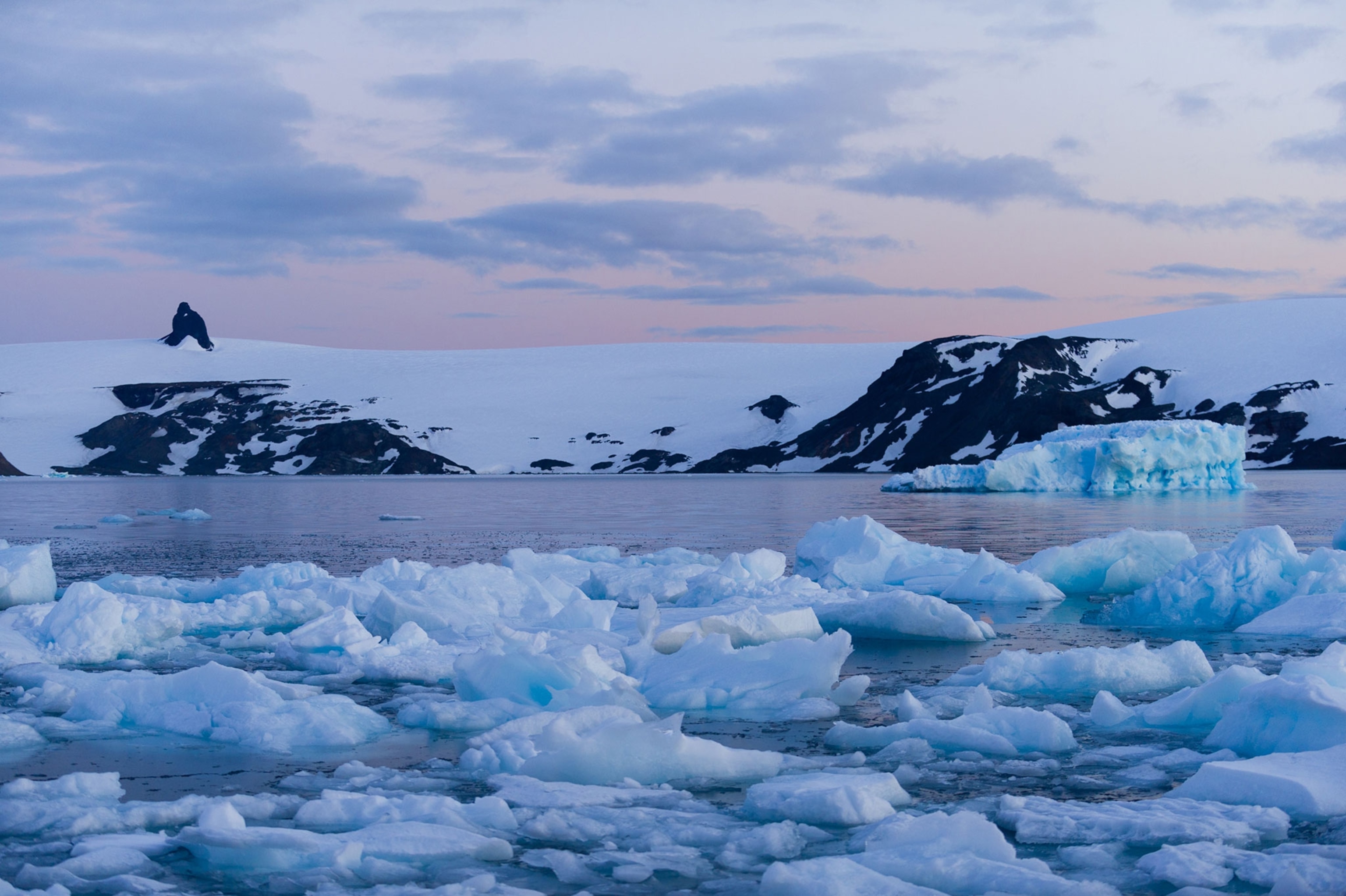 ice along the coast of Antarctica at dusk