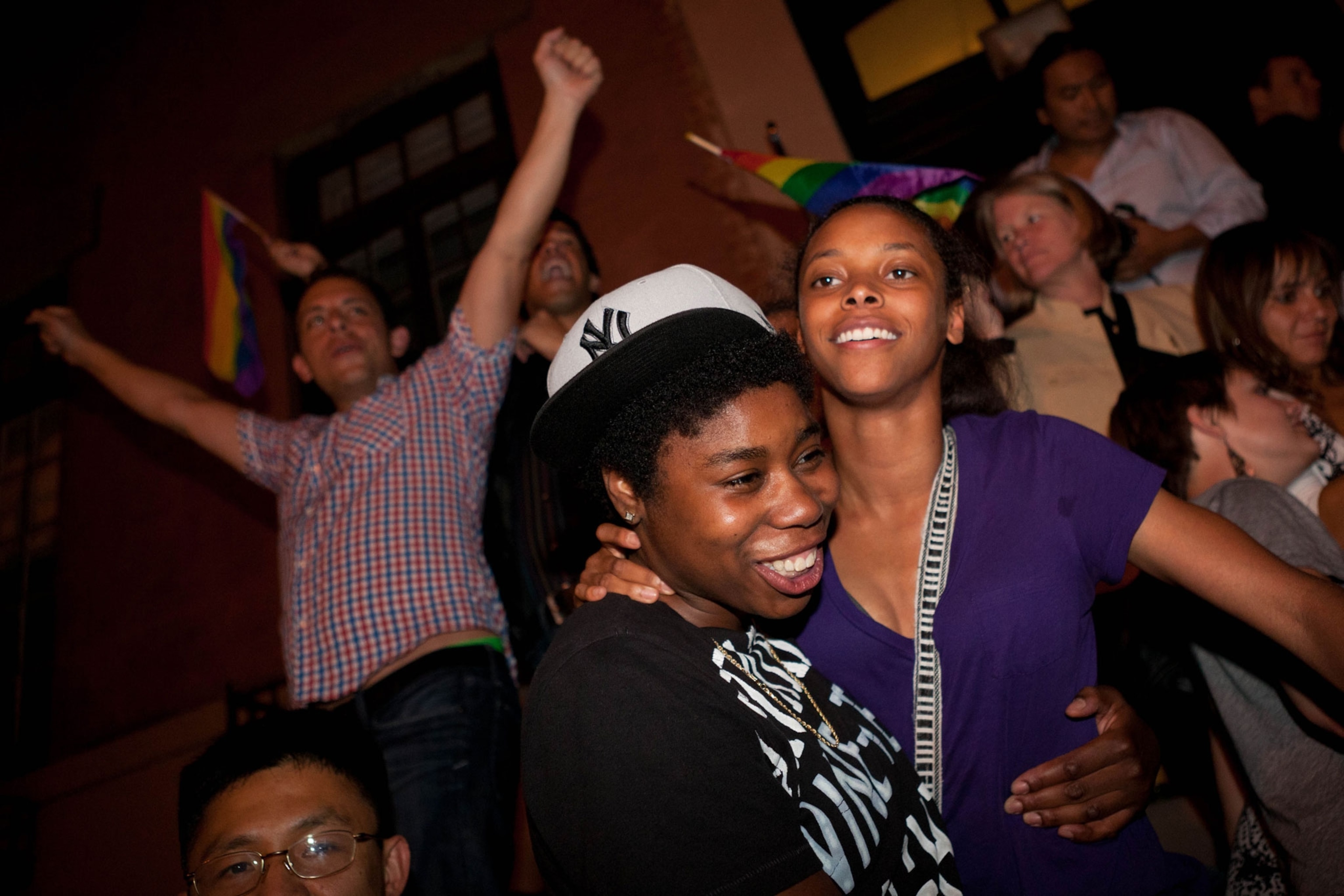 Two women celebrate in front of the Stonewall Inn