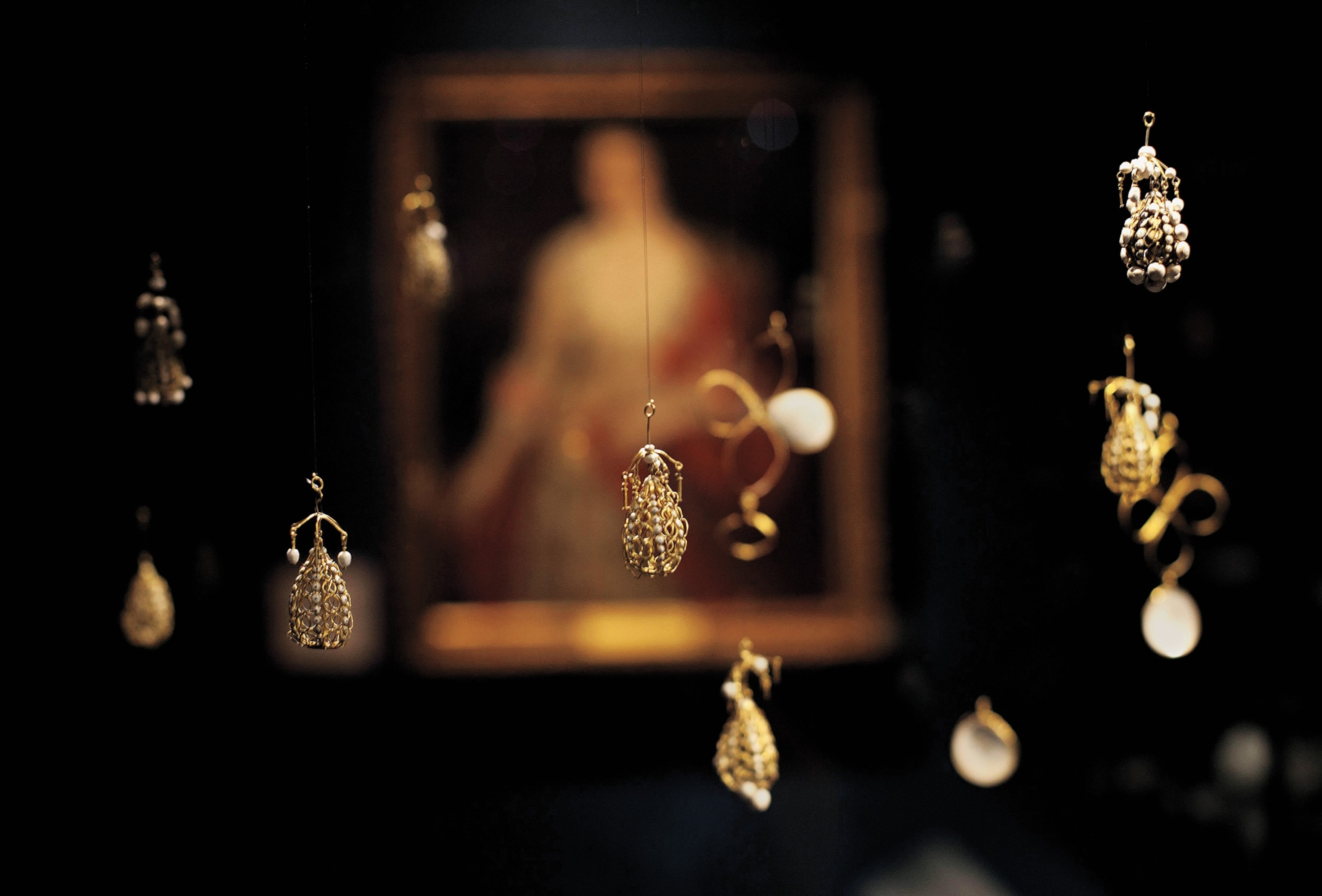 Pearl-and-gold cage pendants, known as “wirework jewels” in the 17th century, found in the Cheapside Hoard.
