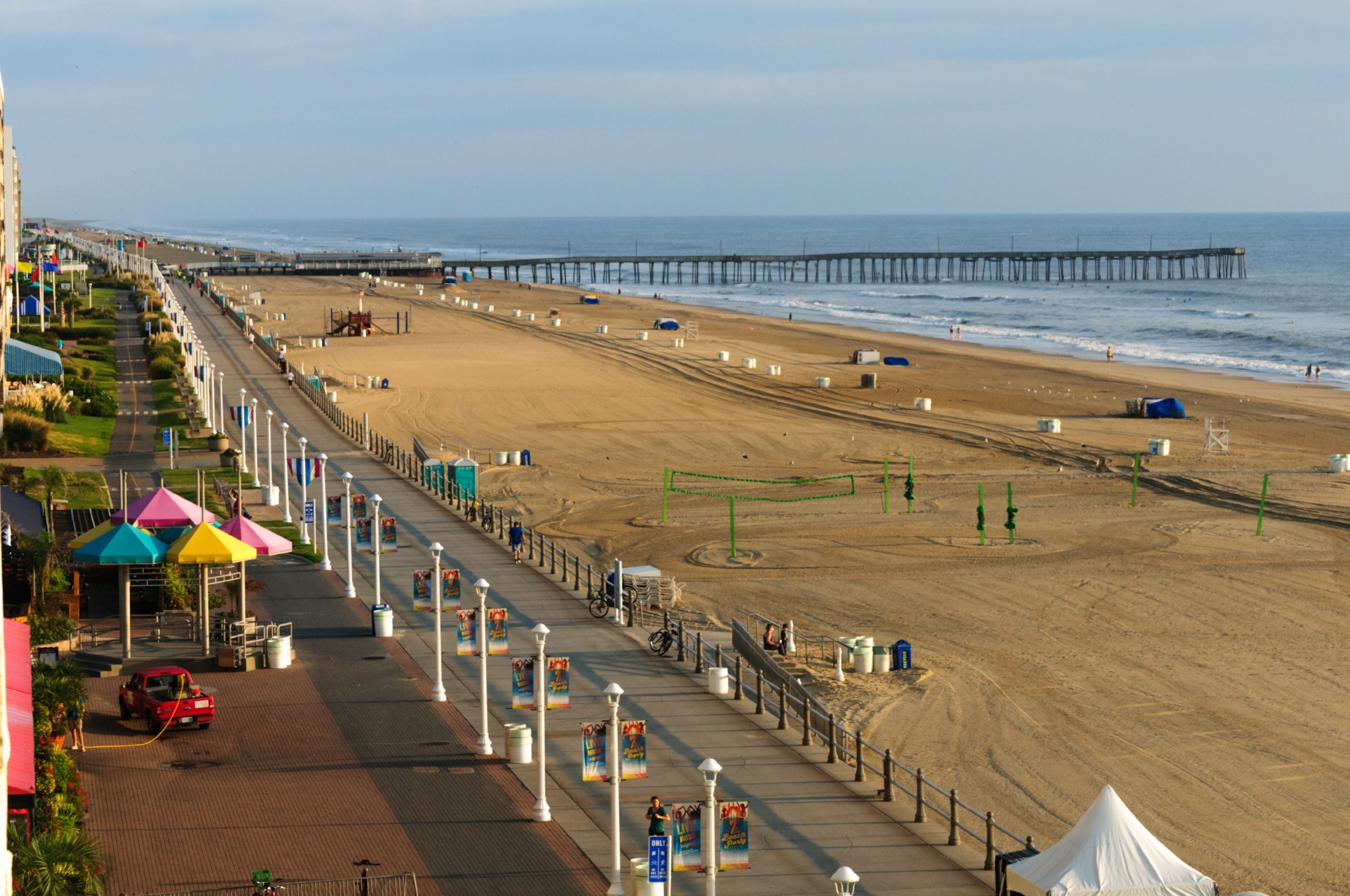 Beachfront pier and boardwalk in the distance