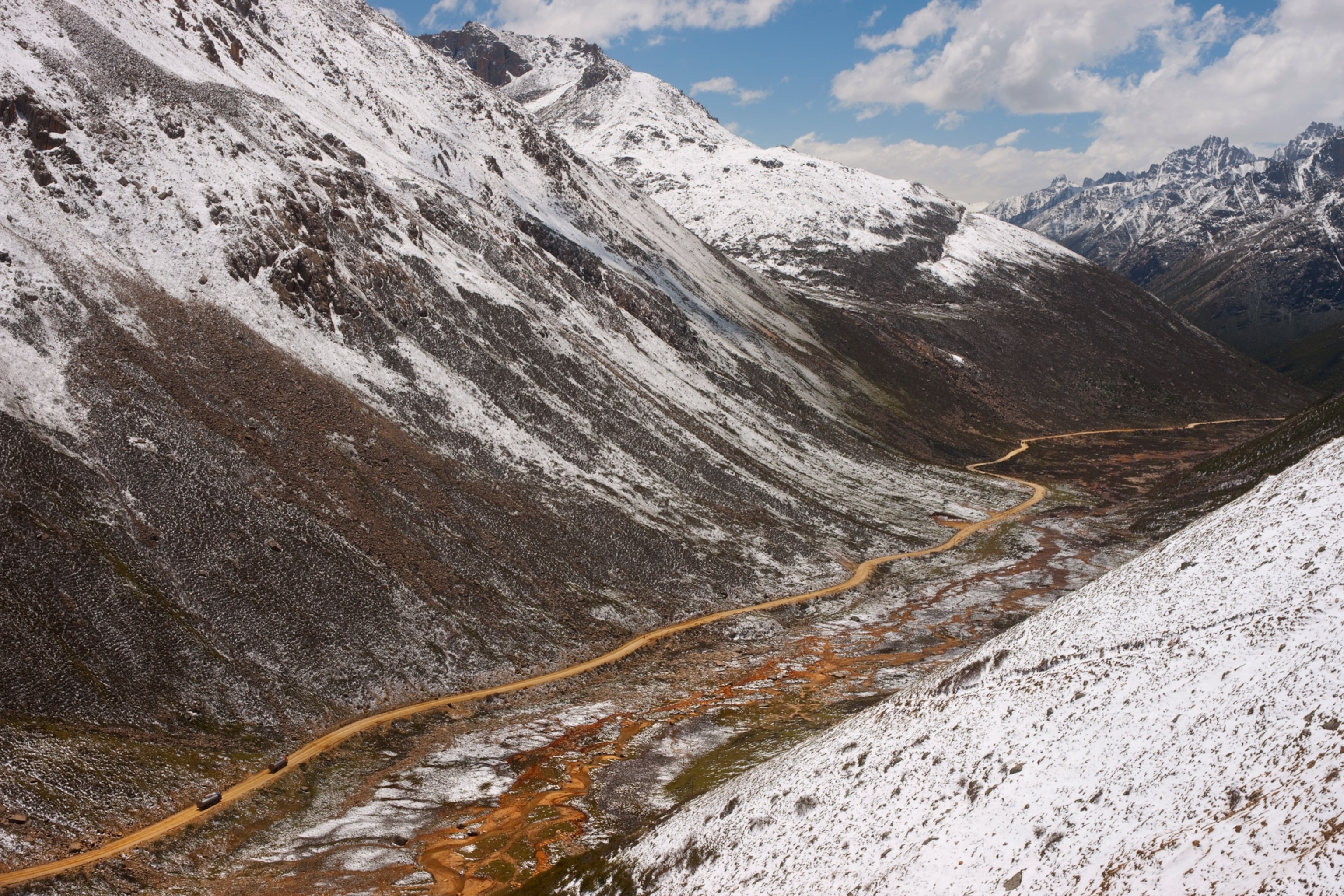 Picture of narrow road through mountains.