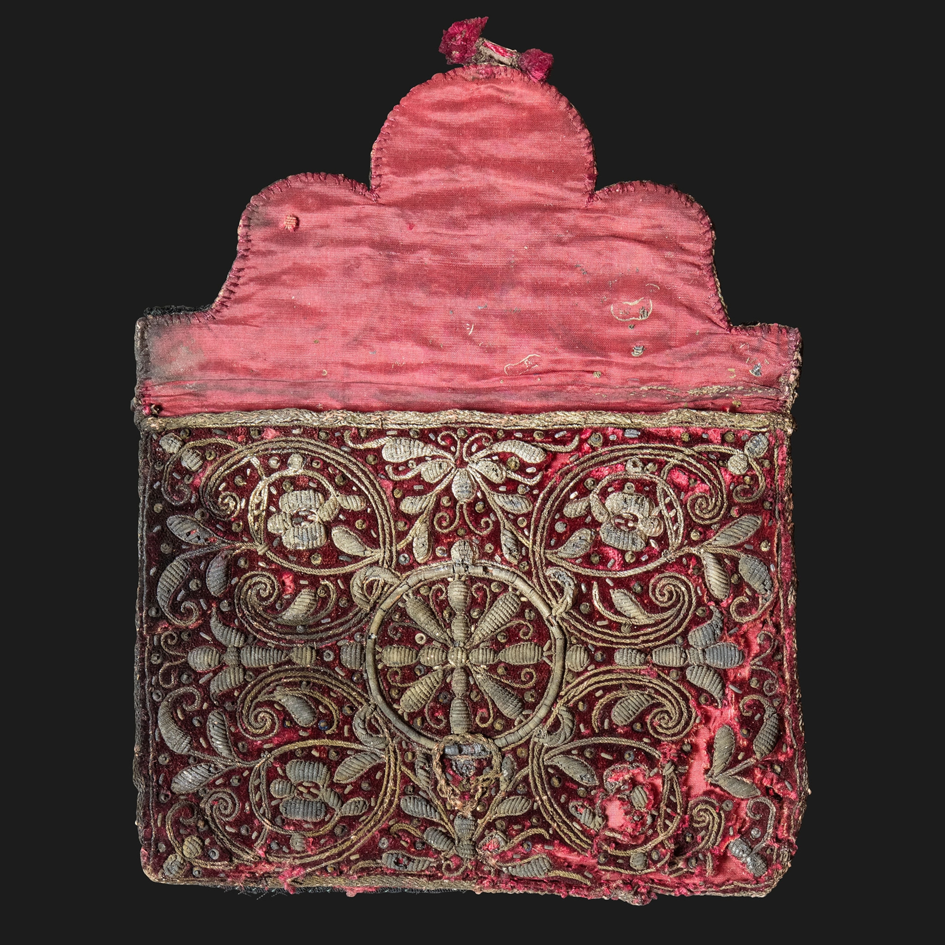 a red silk toiletry case