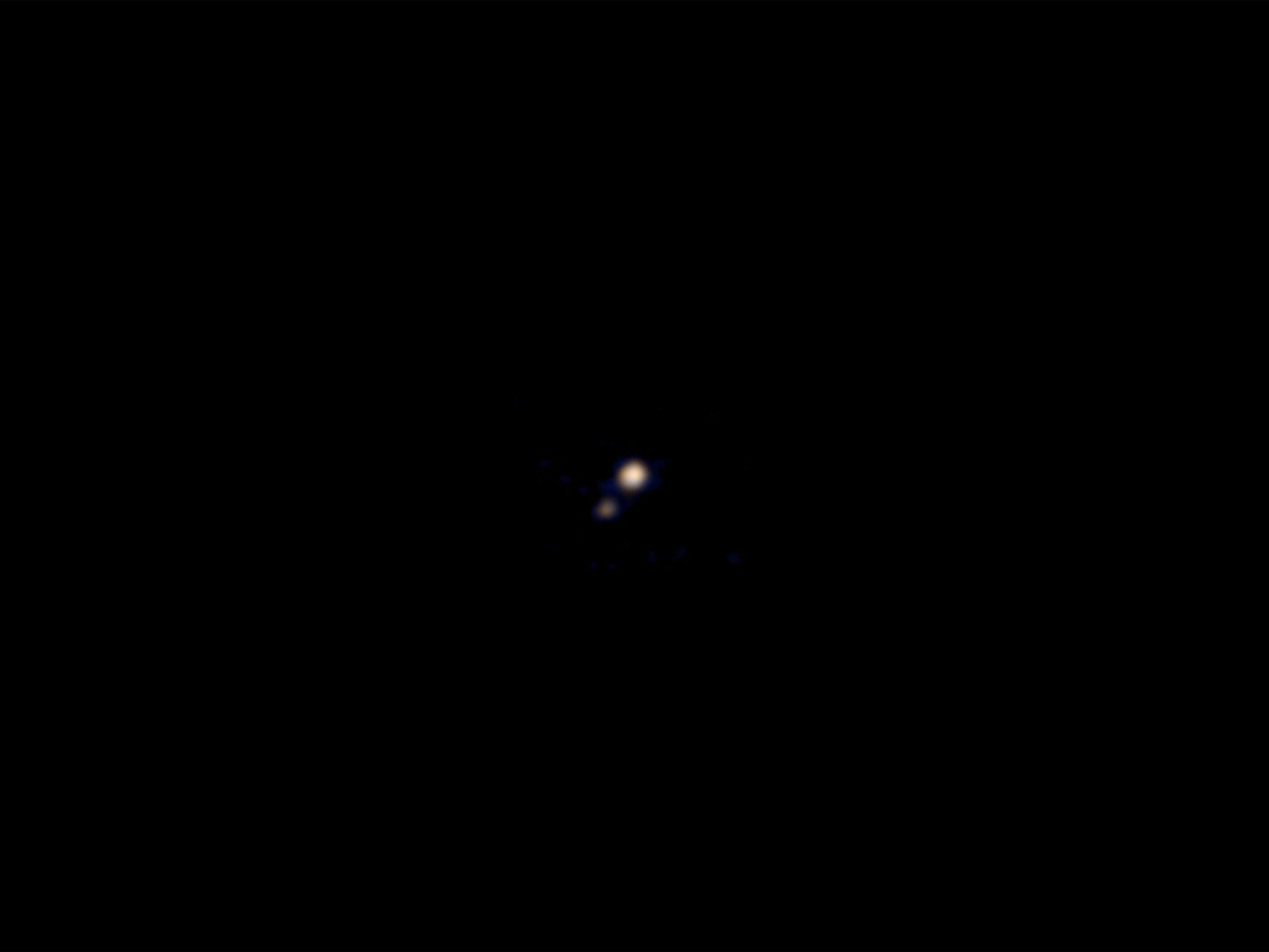 Pluto and Charon on April 9, 2015