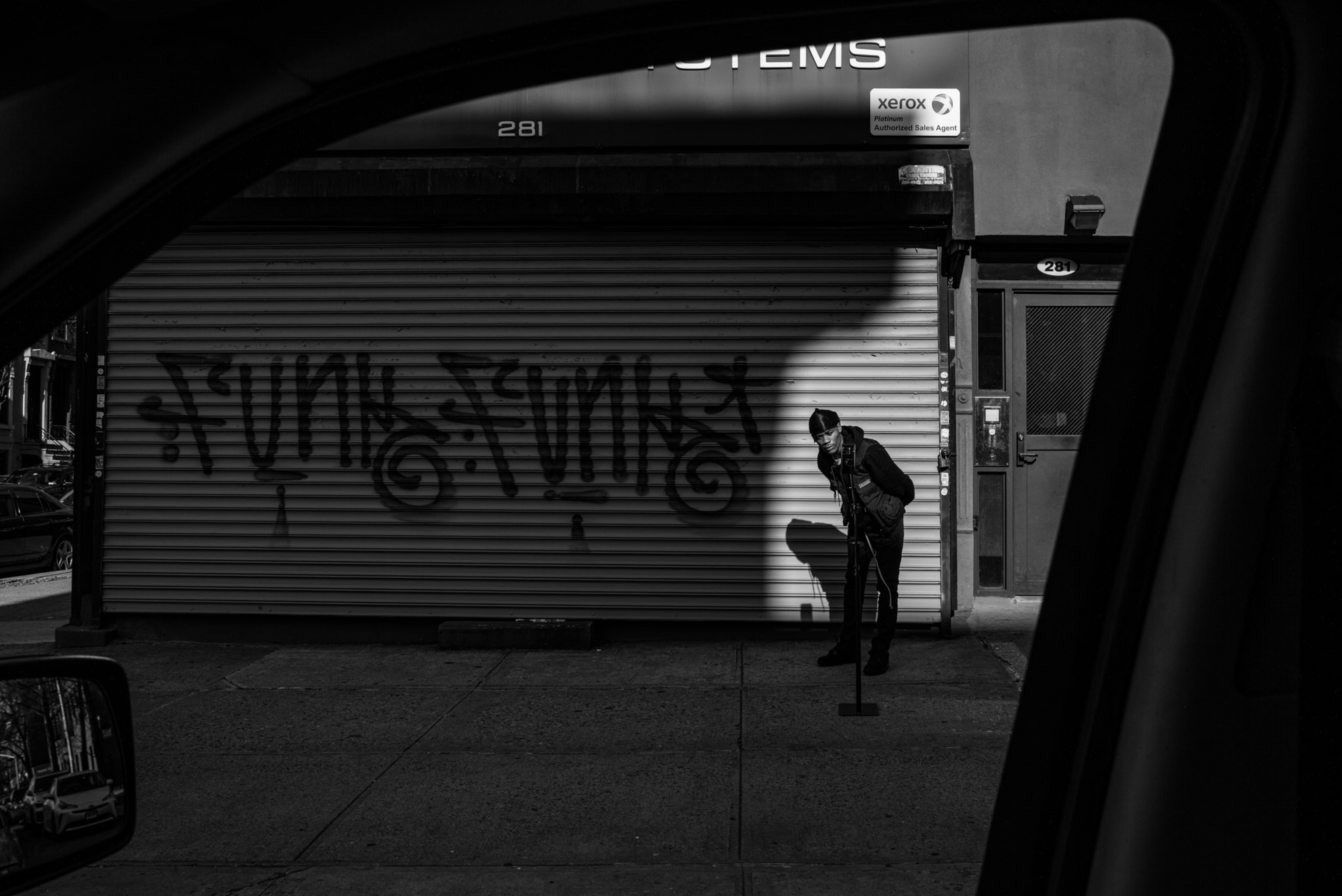 a person outside of a closed store