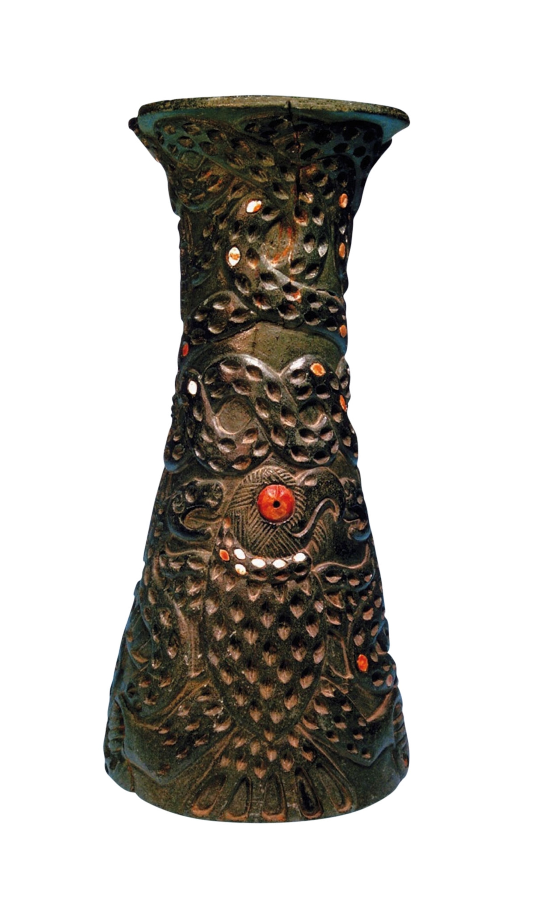 An eagle carved onto a dark vase