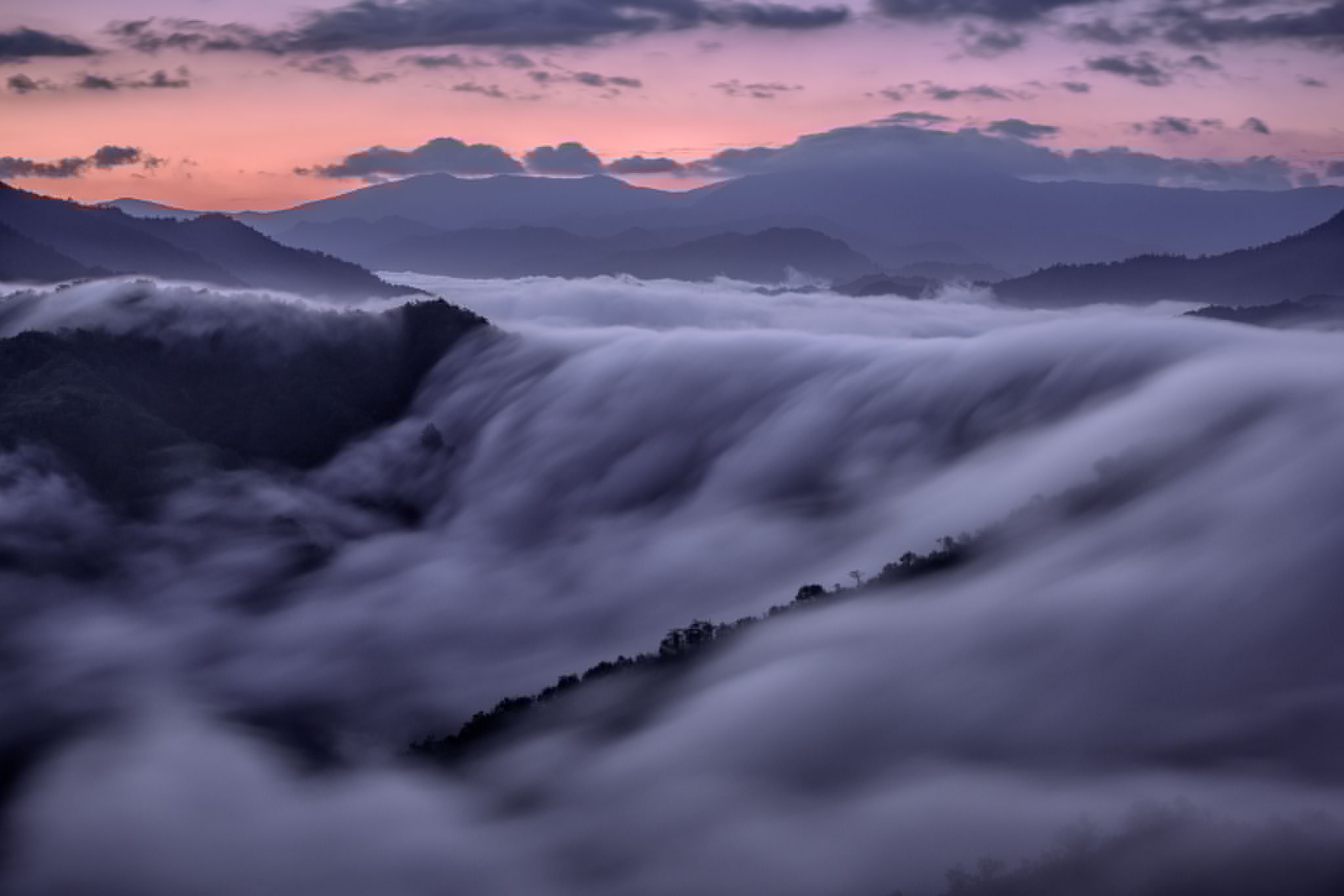 fog over a waterfall in Niigata, Japan