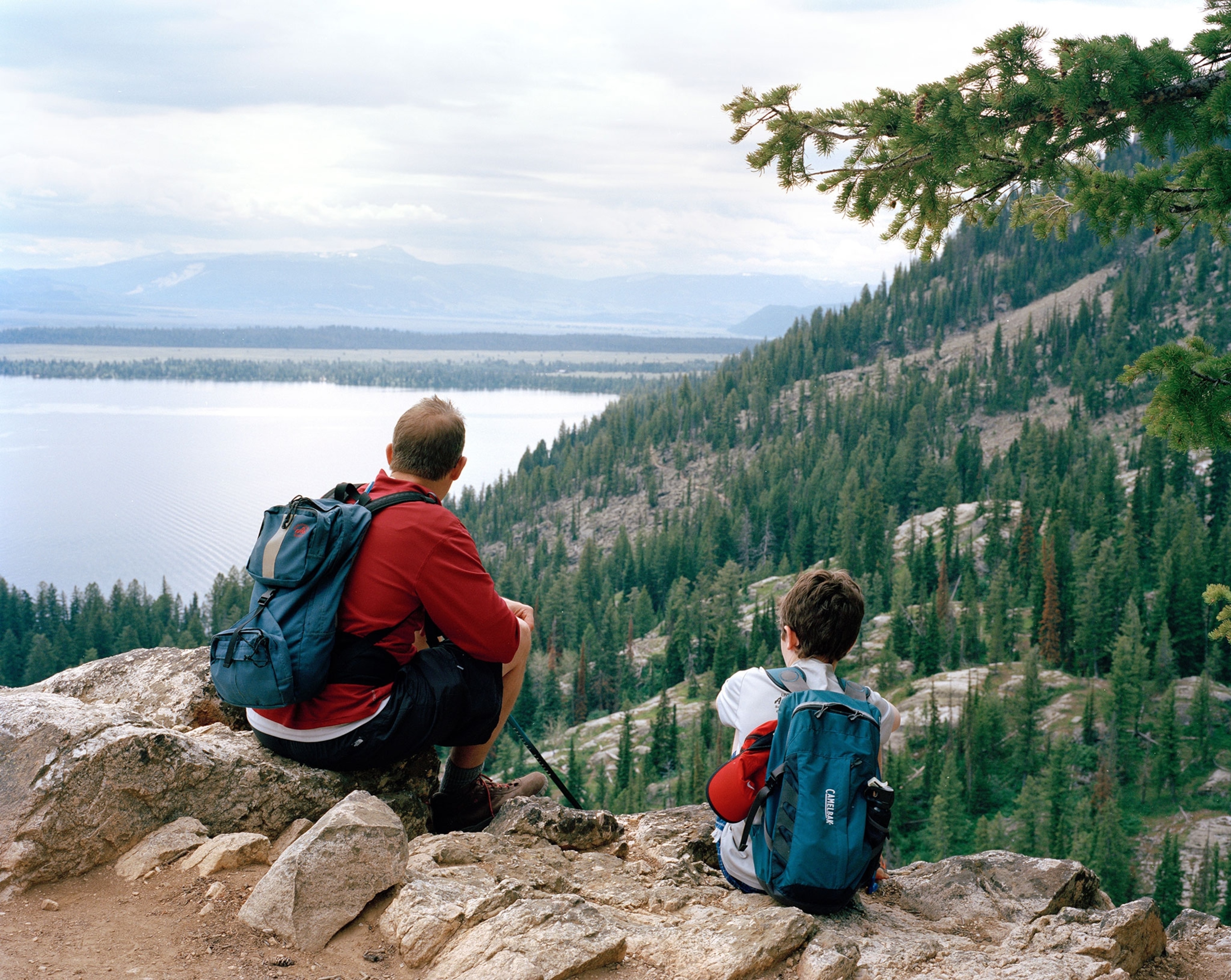 father and sun hiking