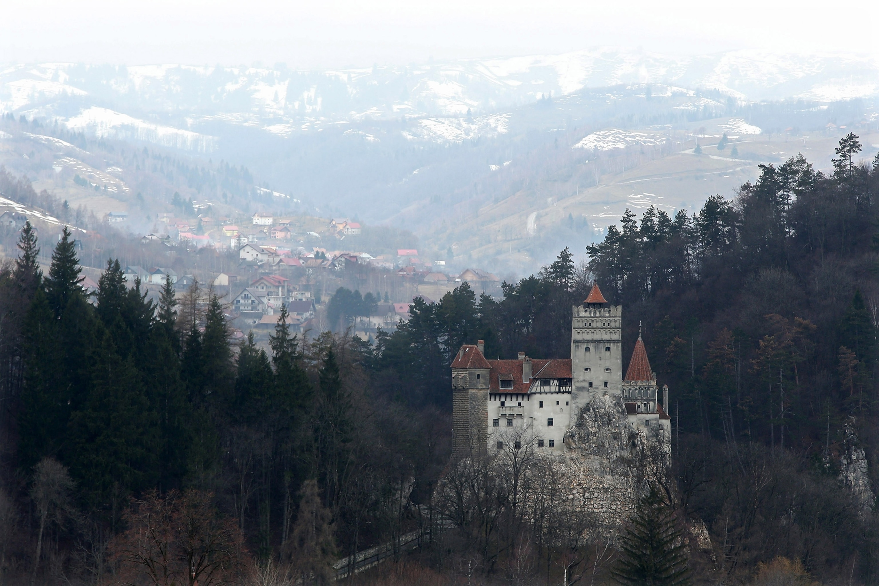 Bran Castle, famous as "Dracula's Castle," stands among Transylvanian mountains in Bran, Romania.