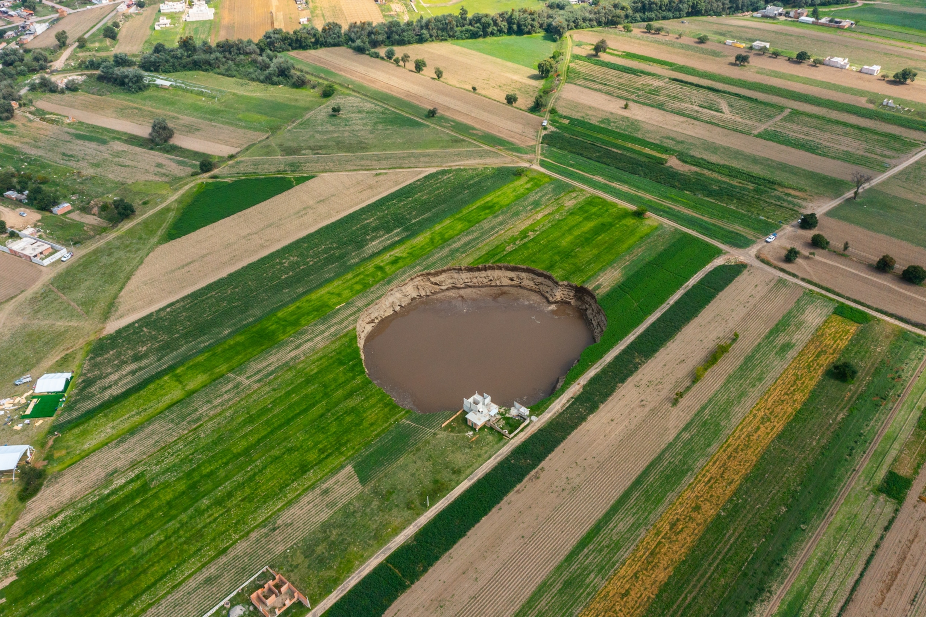Aerial view of a giant sinkhole on June 09, 2021 in Santa María Zacatepec, Mexico