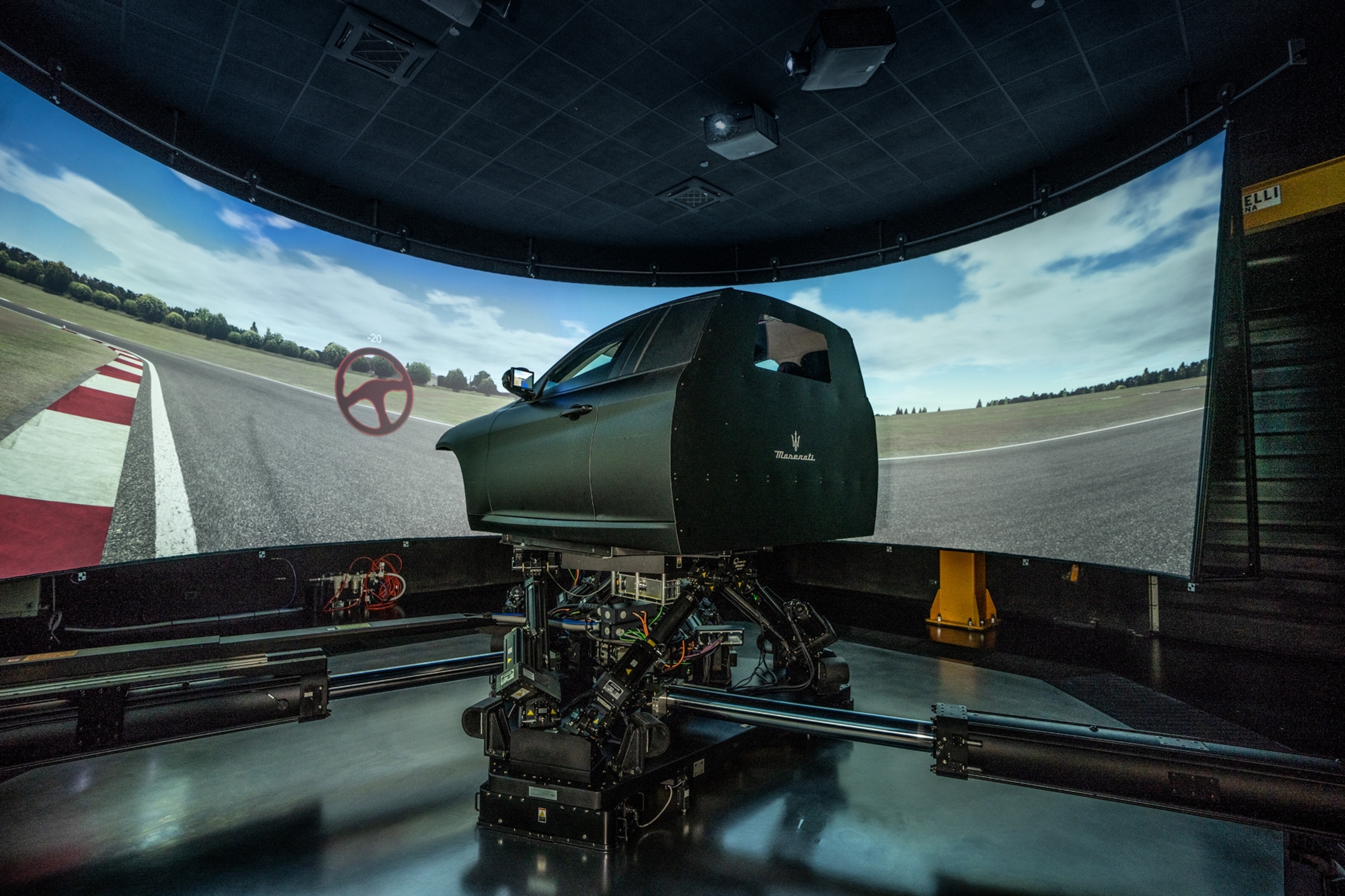 Picture of car simulator in virtual landscape.