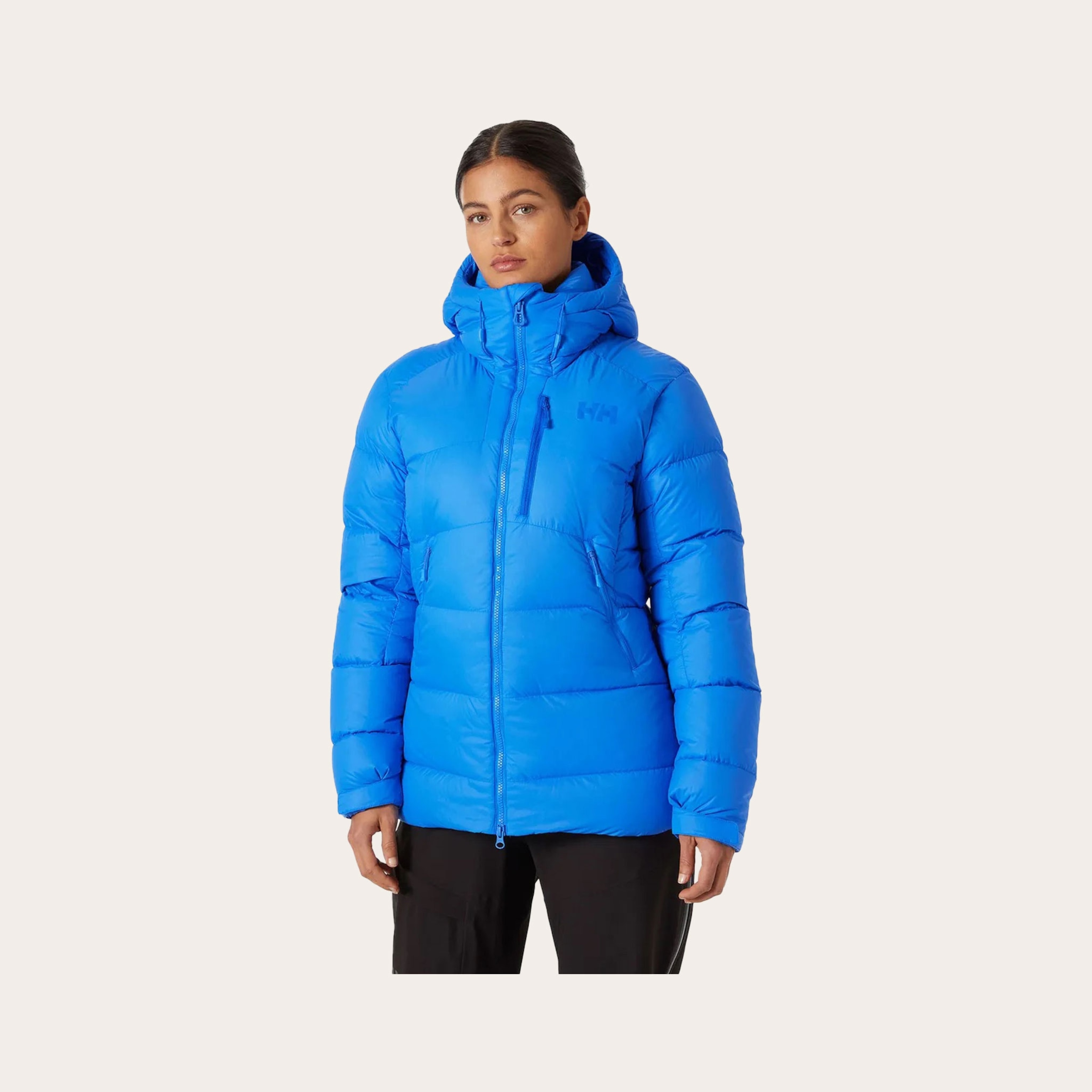 Woman wearing bright blue winter coat.
