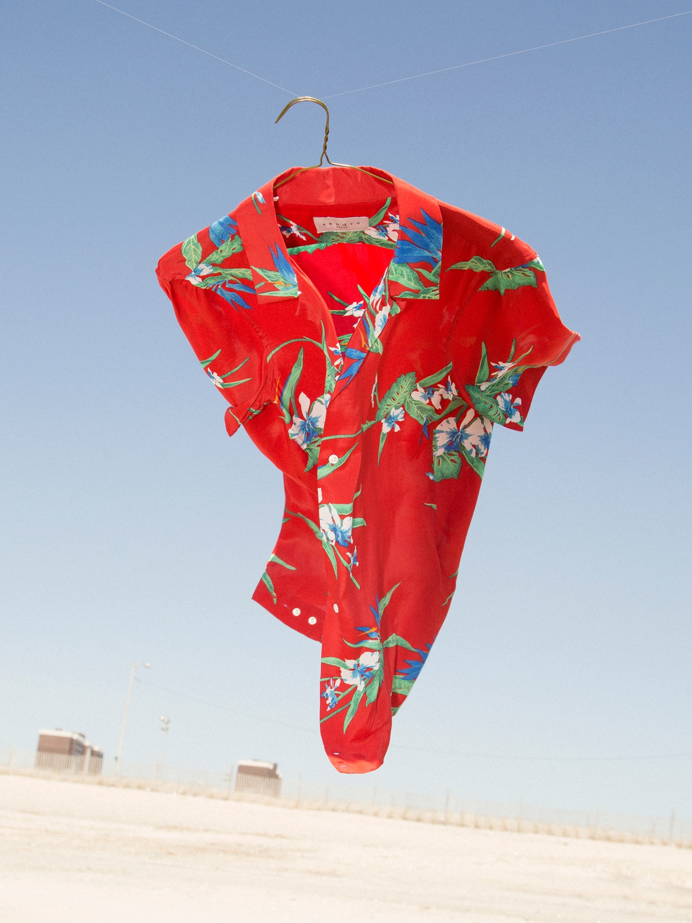 A red and floral shirt billows in the wind.