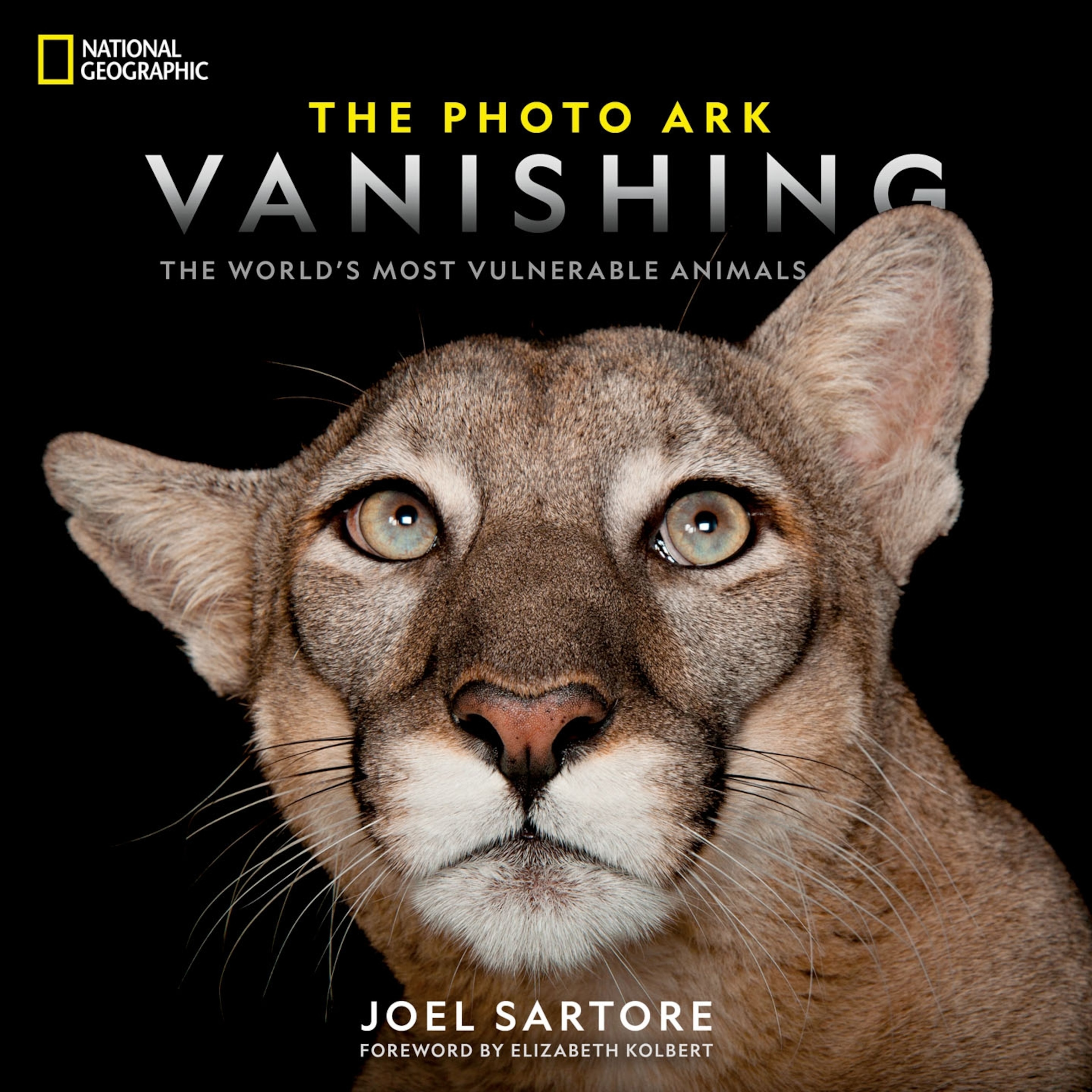 a book cover featuring a large cat and the words the photo ark vanishing