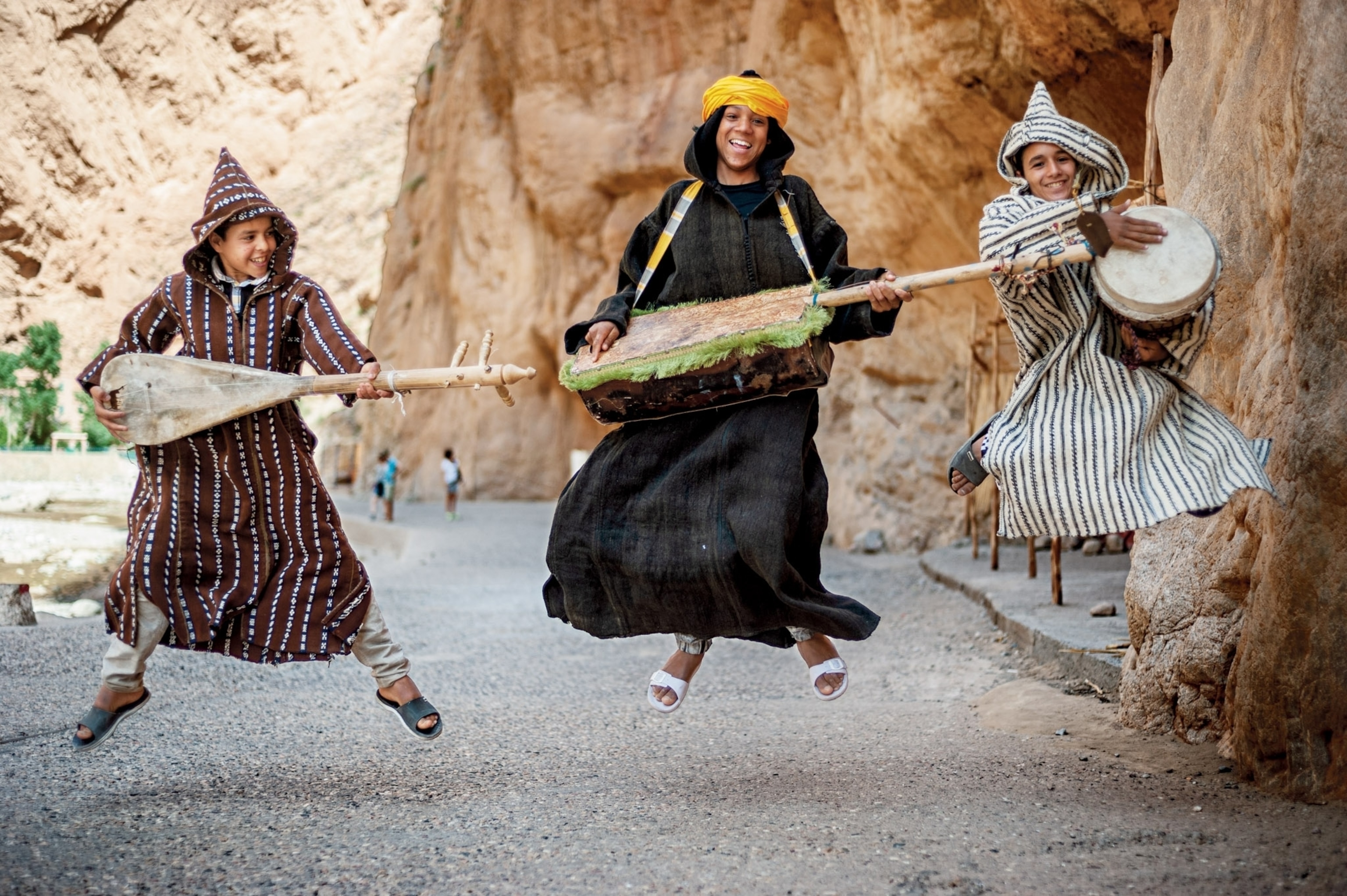boys playing music together in Tinghir Province, Morocco