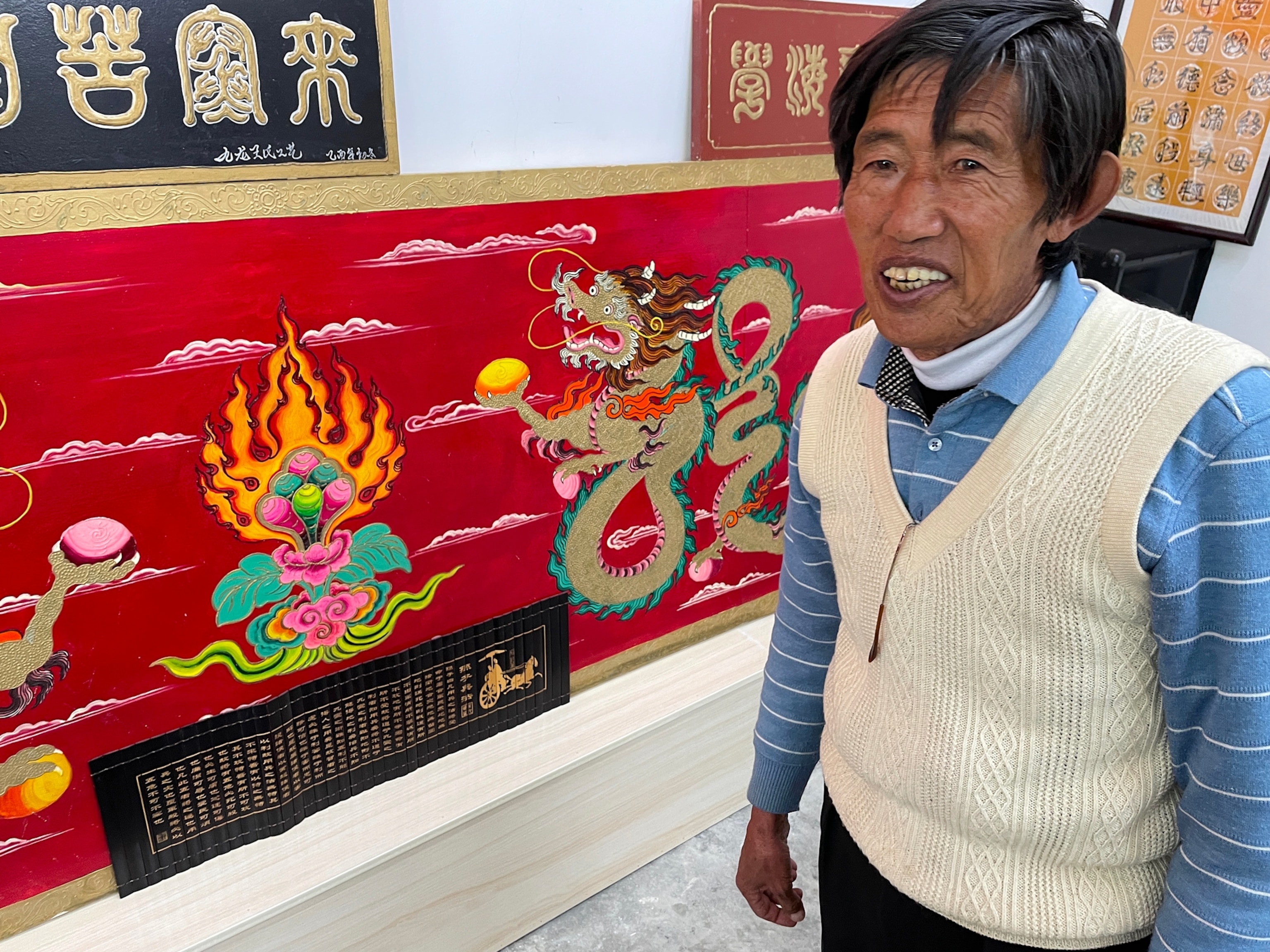 Picture of man standing by red painting