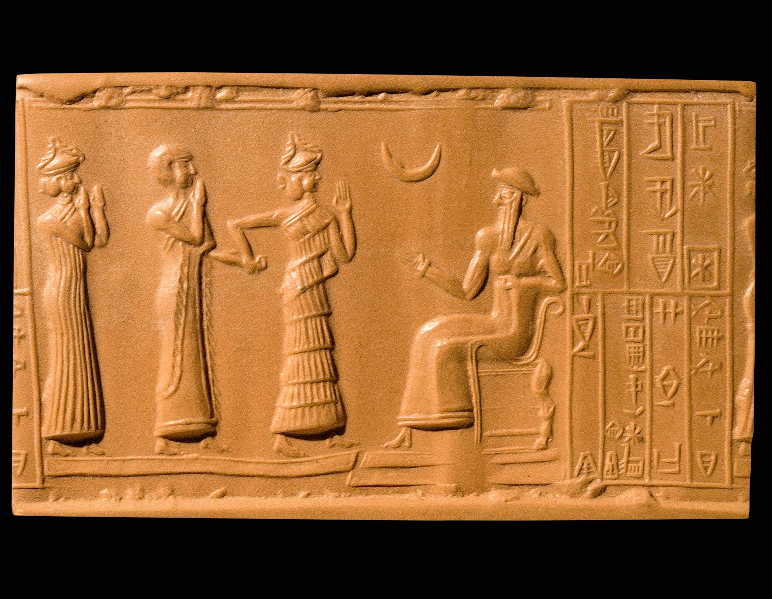 A cast of a cylindrical seal from circa 2100 B.C. shows goddesses standing before King Ur-Nammu.