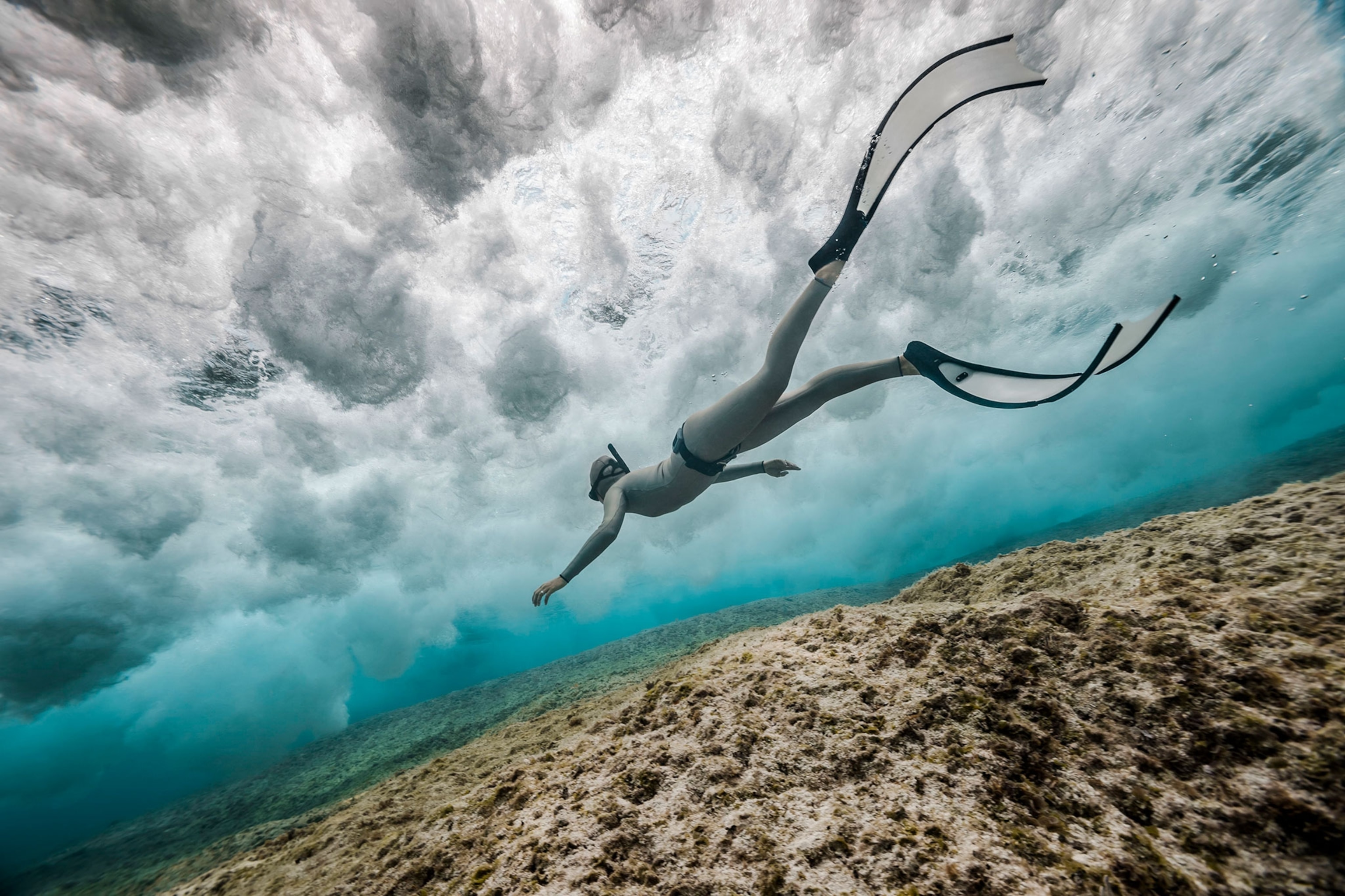 waves crashing over a diver