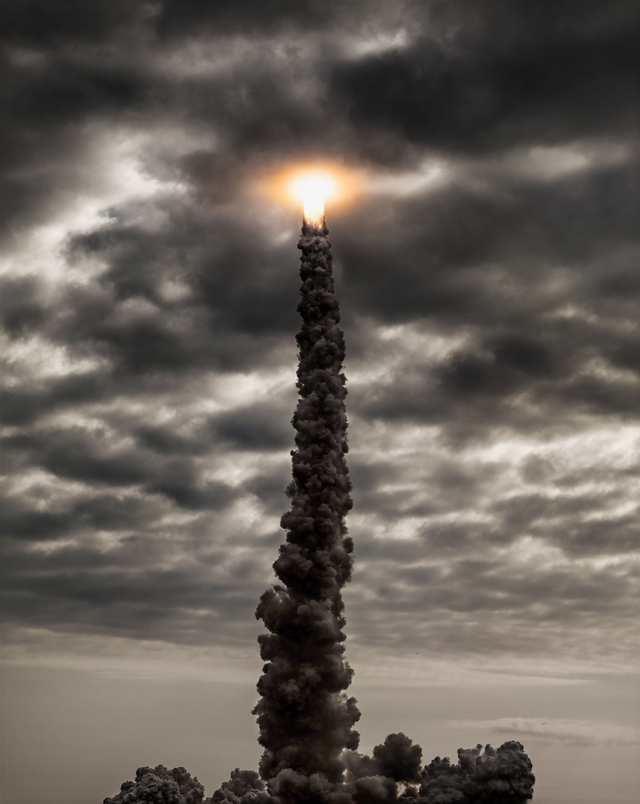 NASA Shuttle Endeavor passes through the cloud ceiling after launching from Kennedy Space Center.