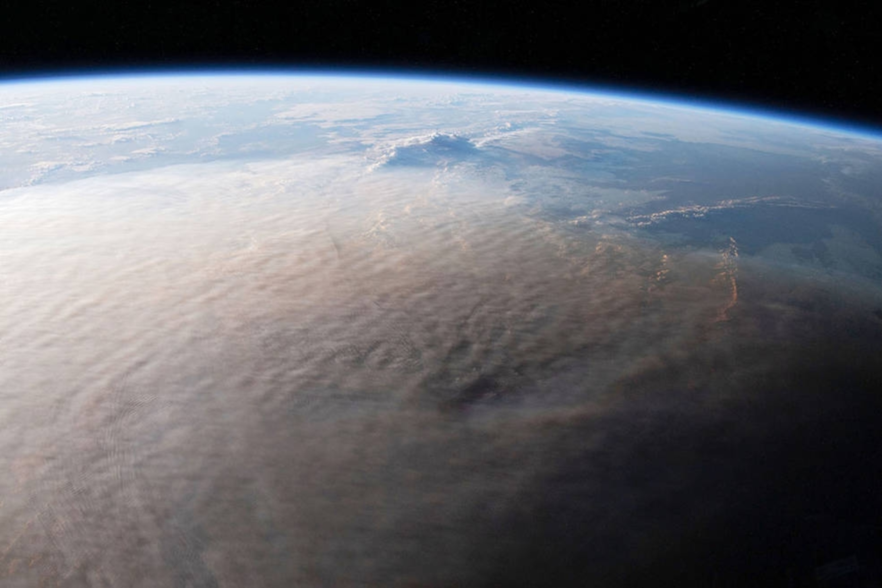 Photo from space of the eruption over the ocean.