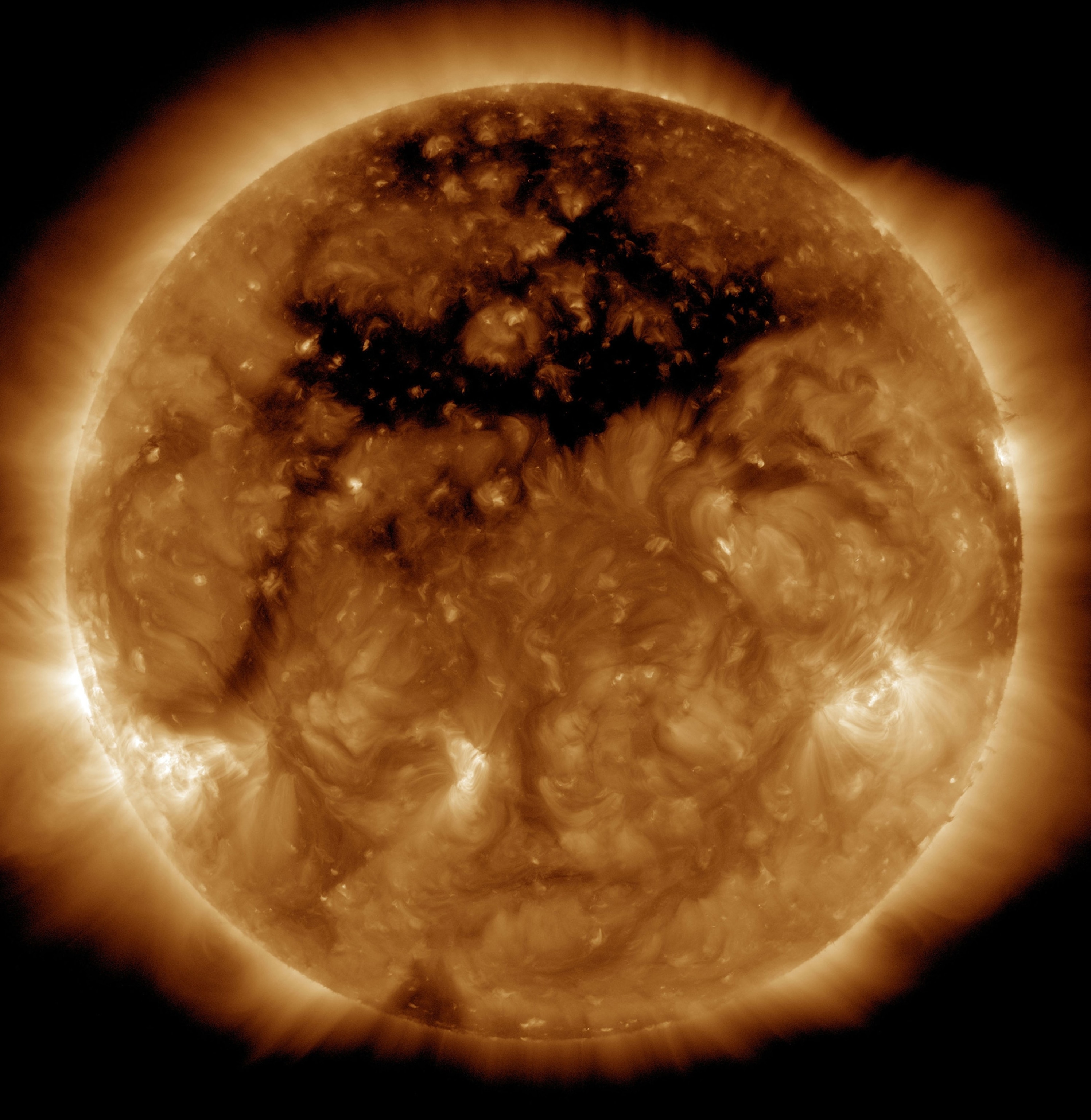 A bronze colorized image of the sun.