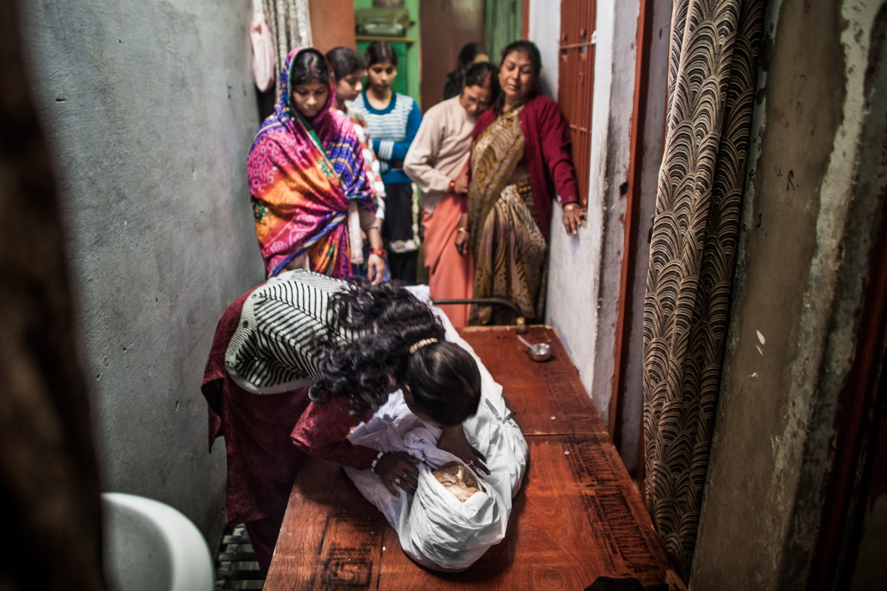 a family caring for dead body
