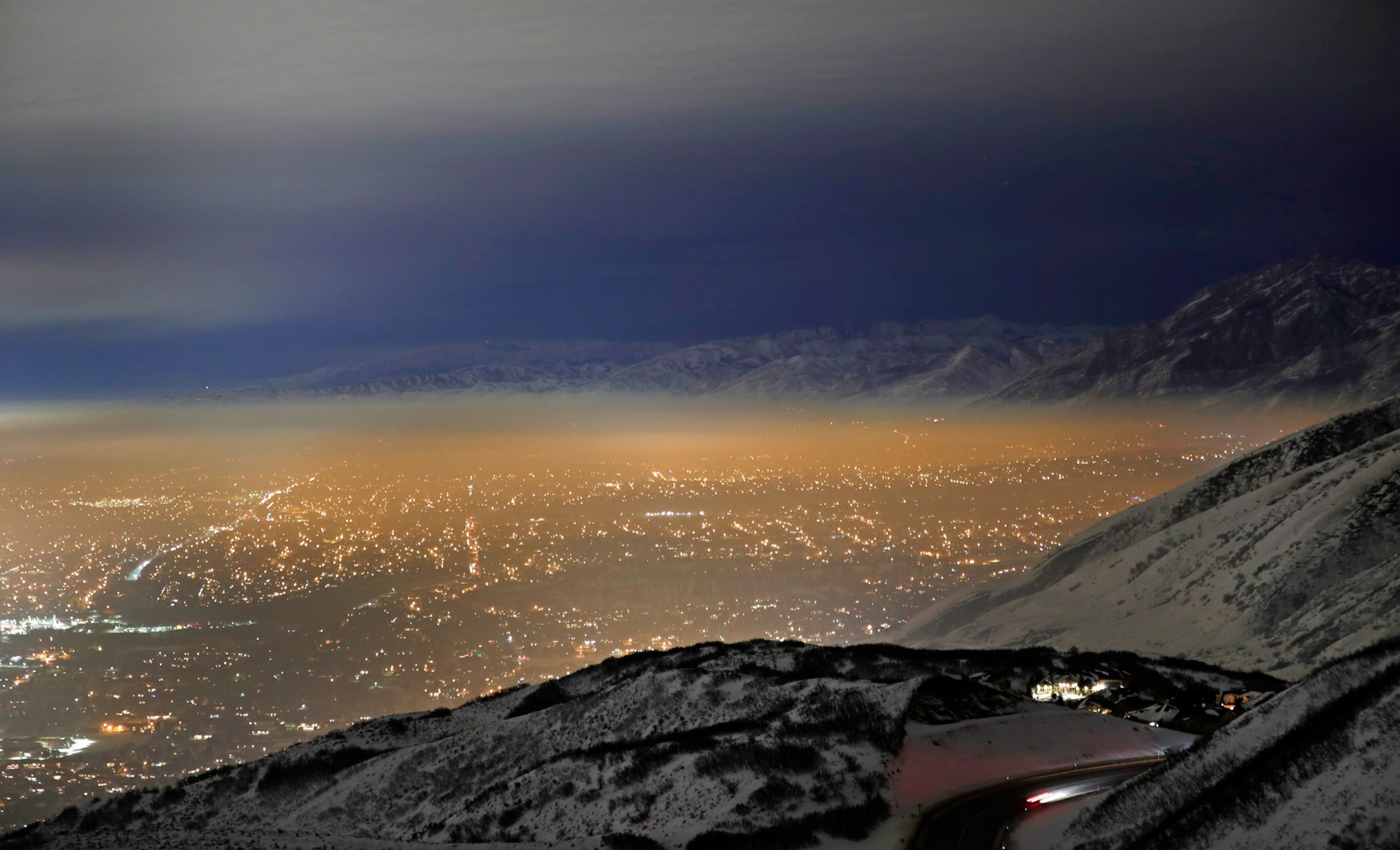 lights shine through the smoggy inversion layer trapped over the Salt Lake vallery