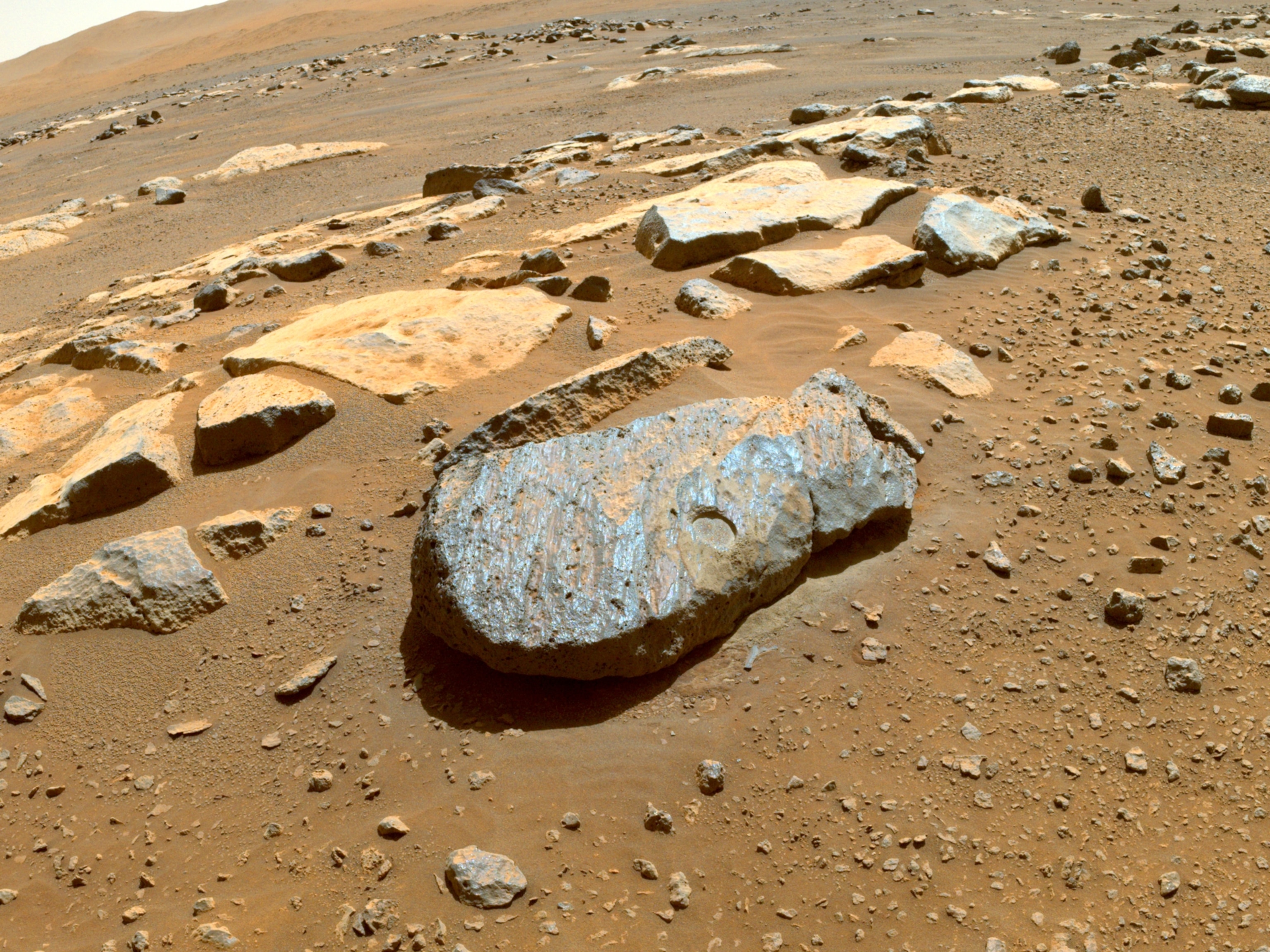 Picture of the Martian rock "Rochette" with a circular patch abraded into its surface.