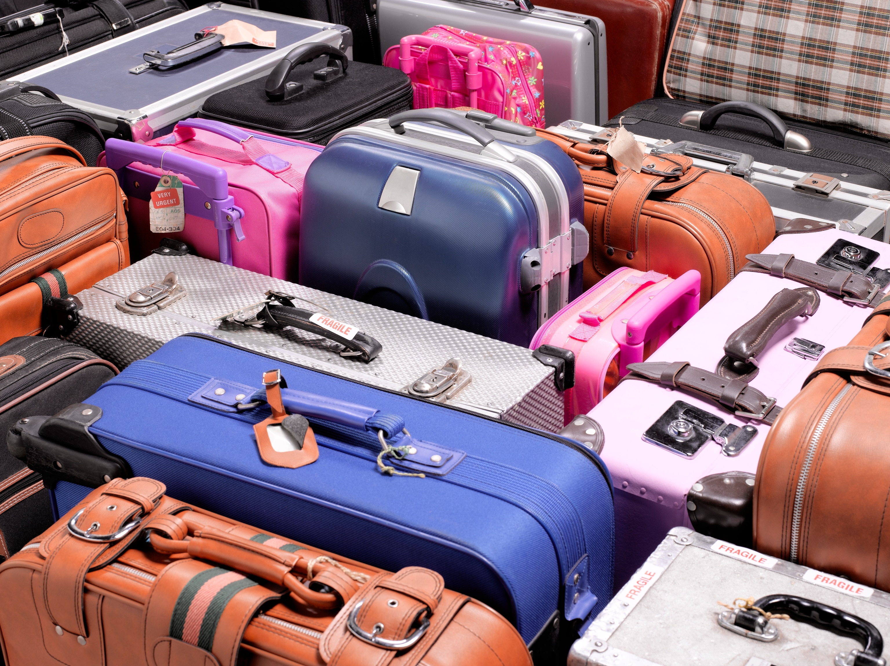 Colorful variety of suitcases, close up