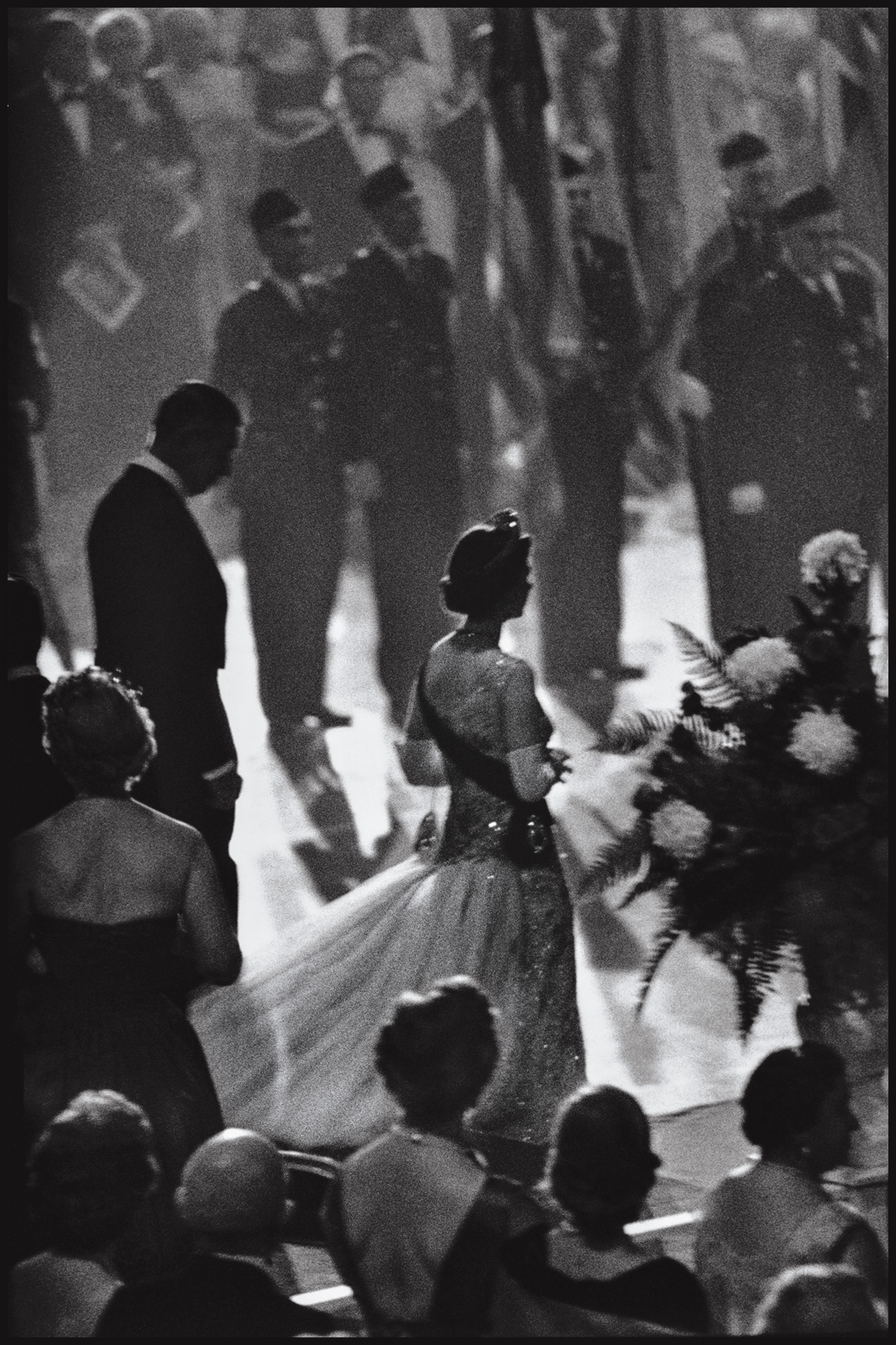The queen stands alone during a visit to the United States in 1957.