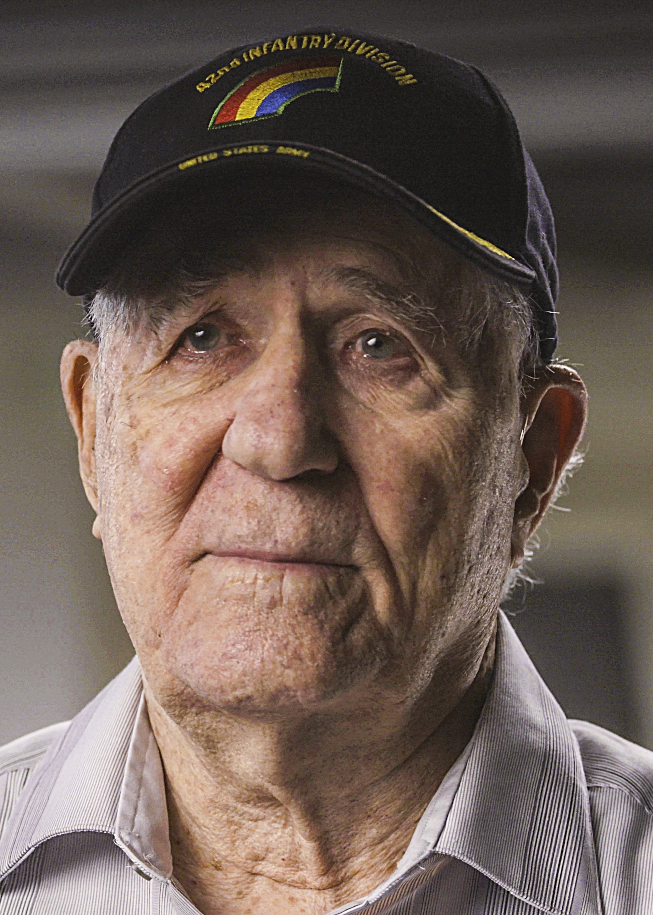 an older man wearing a hat