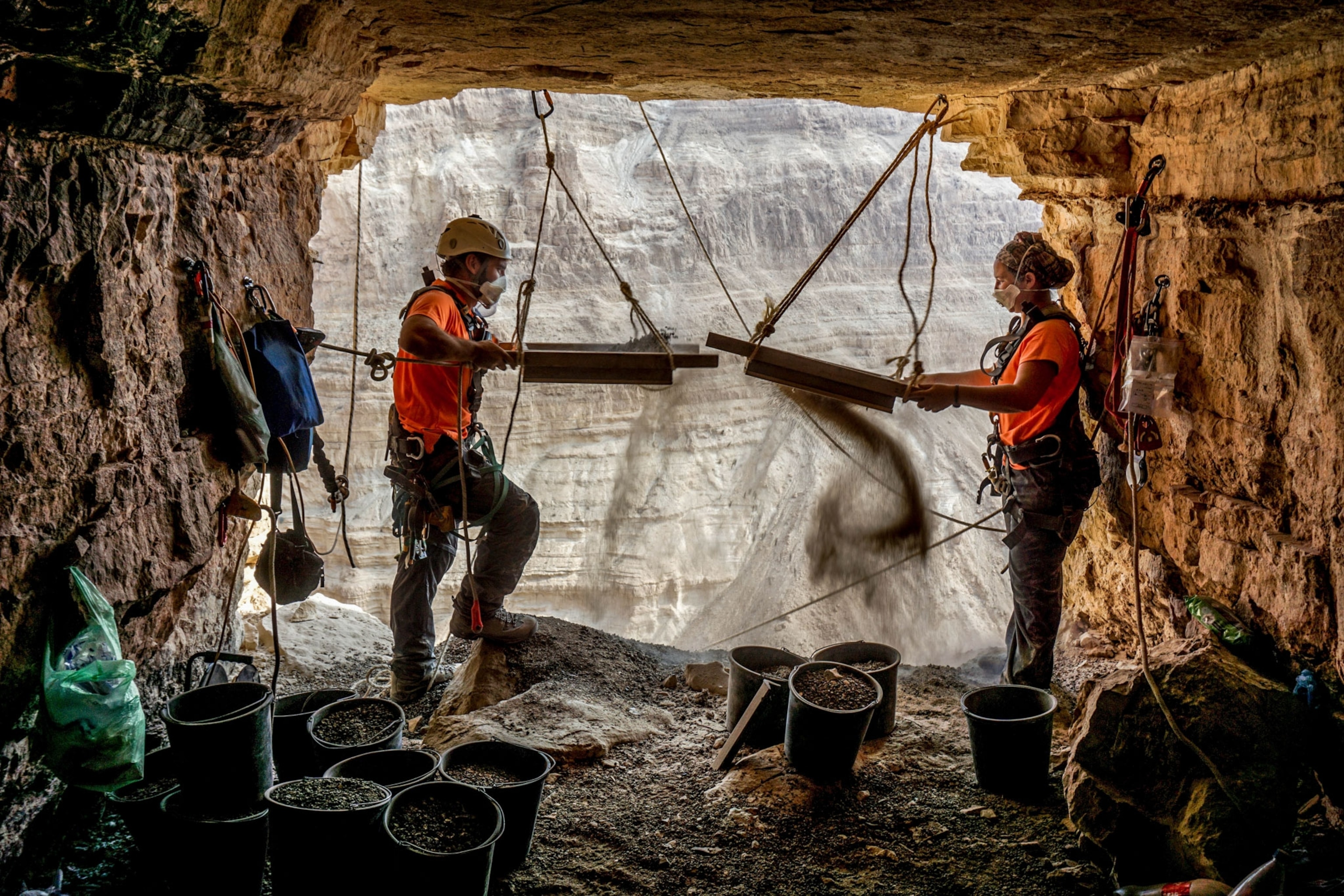 archaeologists sieving finds in a cave