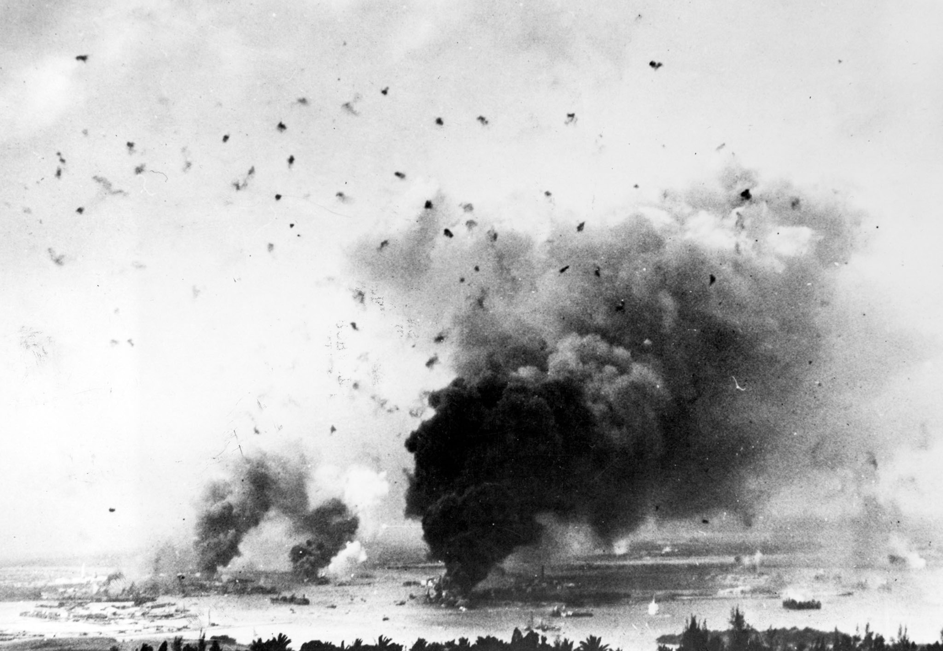 U.S.S. Arizona on fire after being attacked during Pearl Harbor.