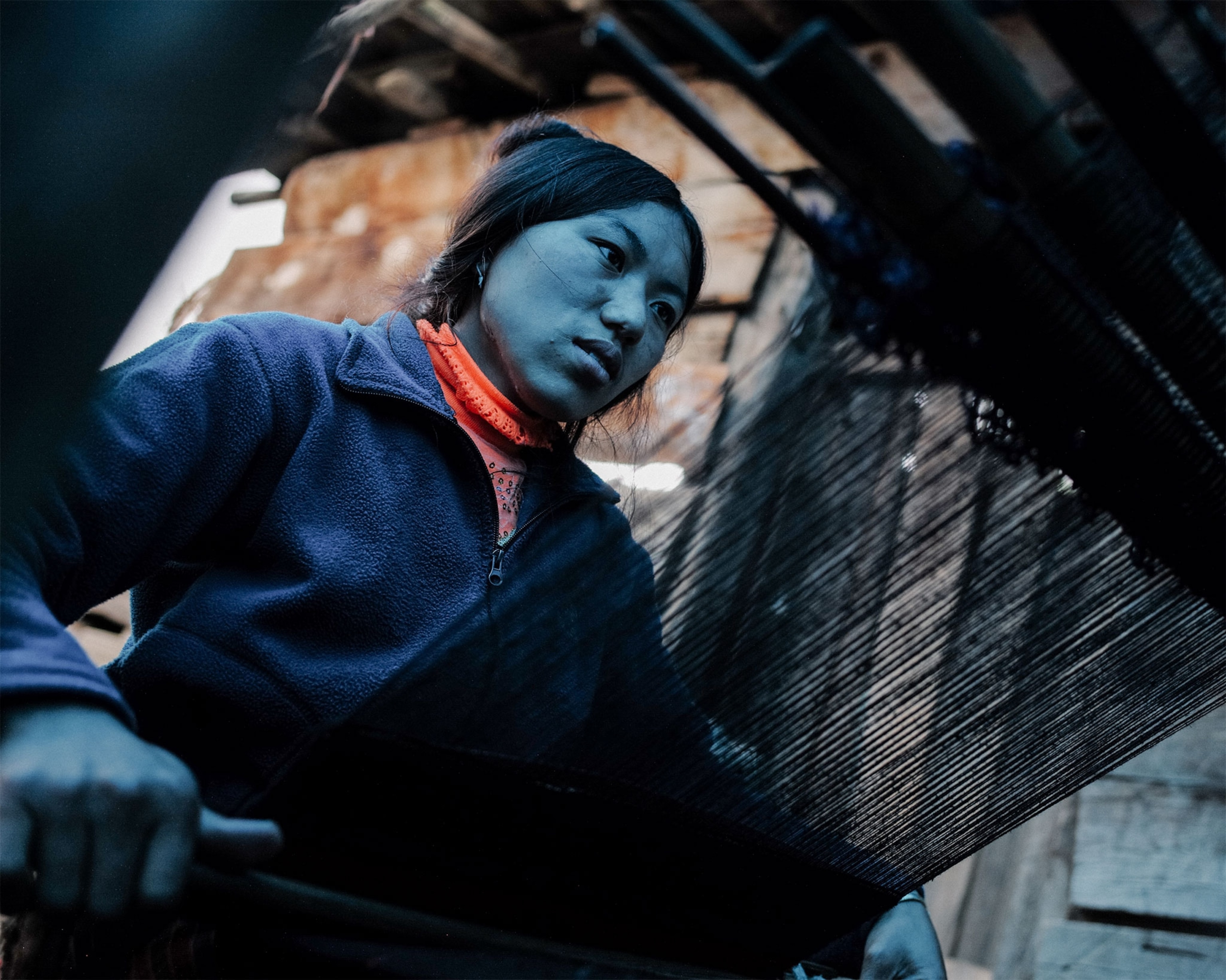 a woman weaving in Bhutan