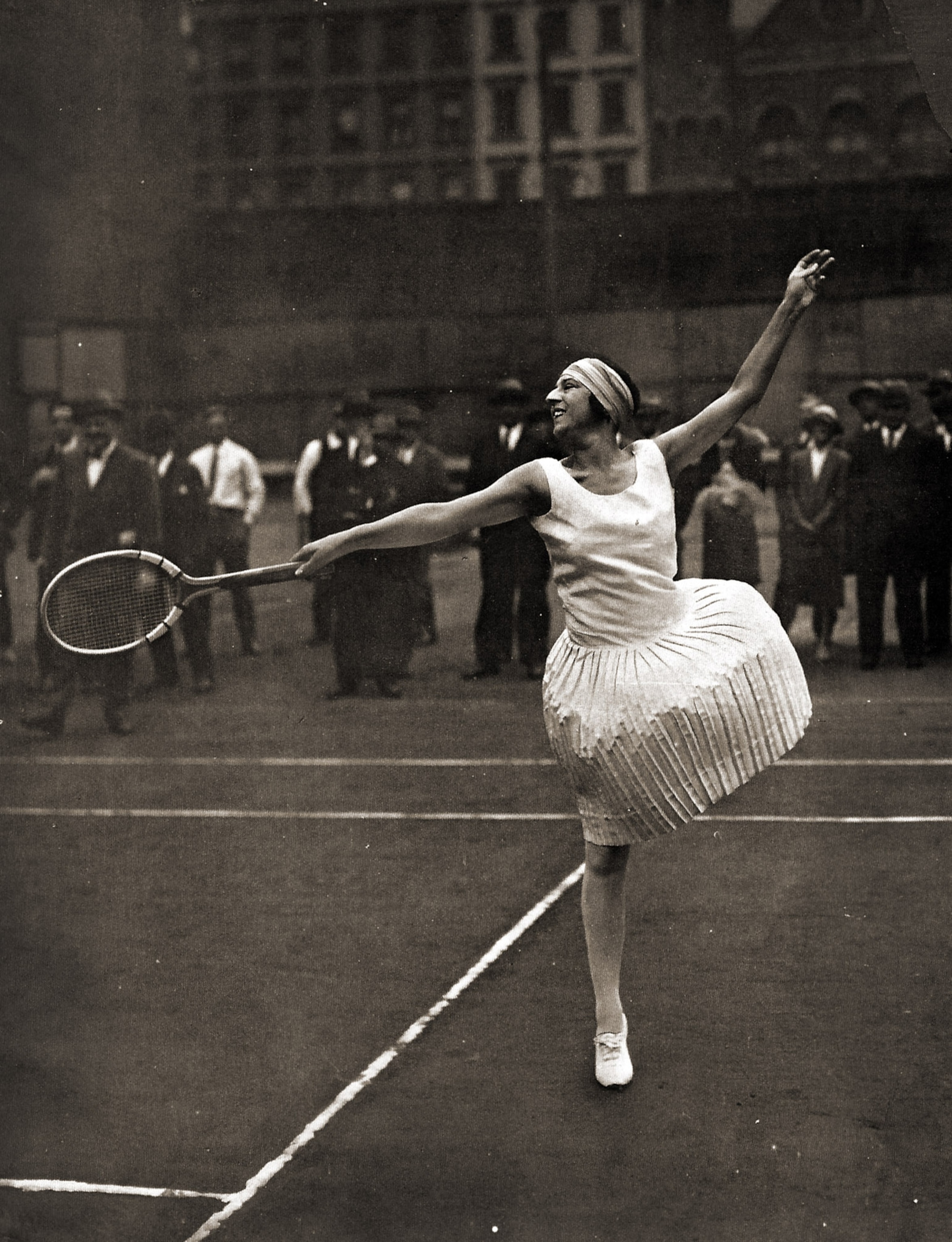 The famous French star Suzanne Lenglen practices outdoors.