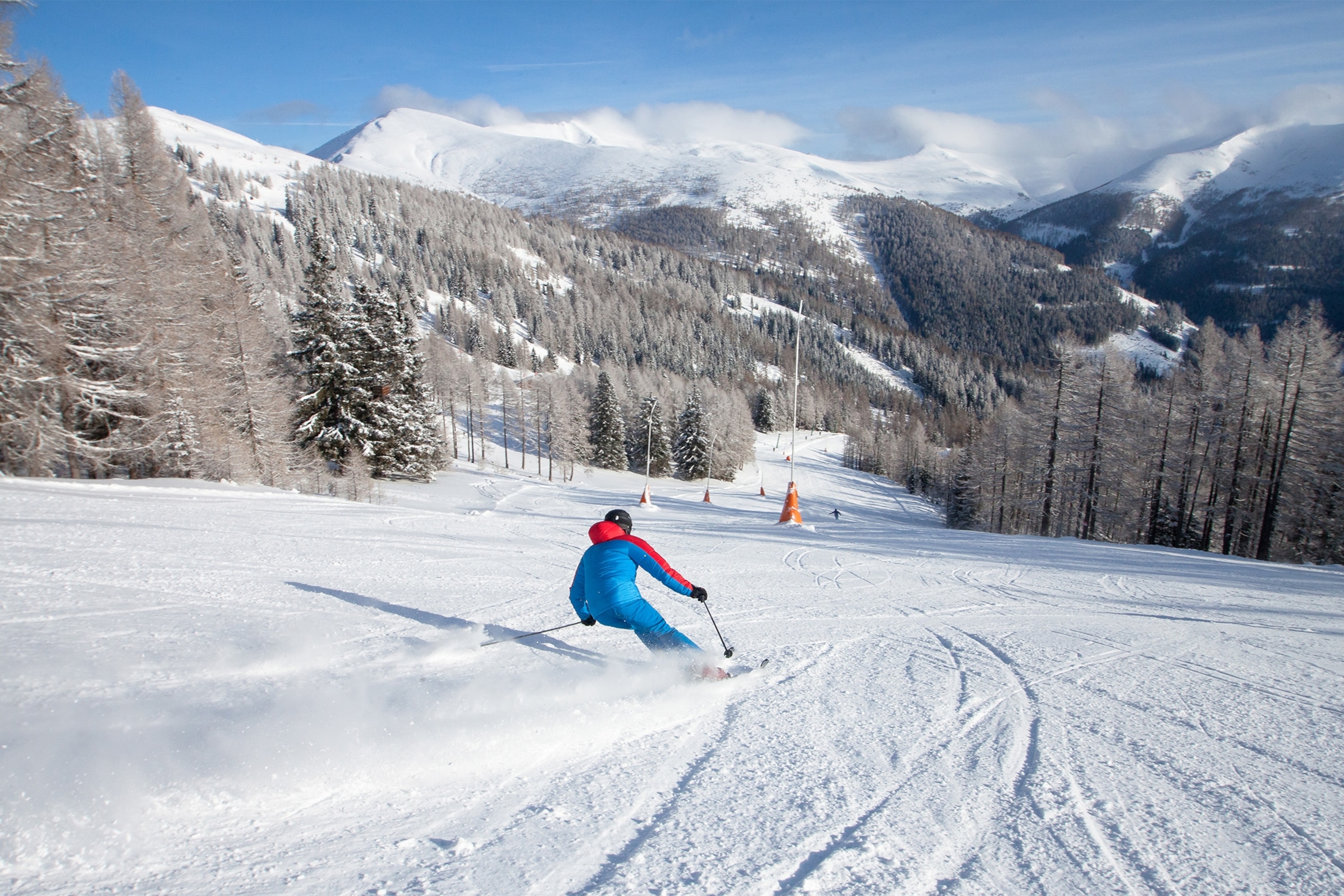 a skier skiing down a mountain slope