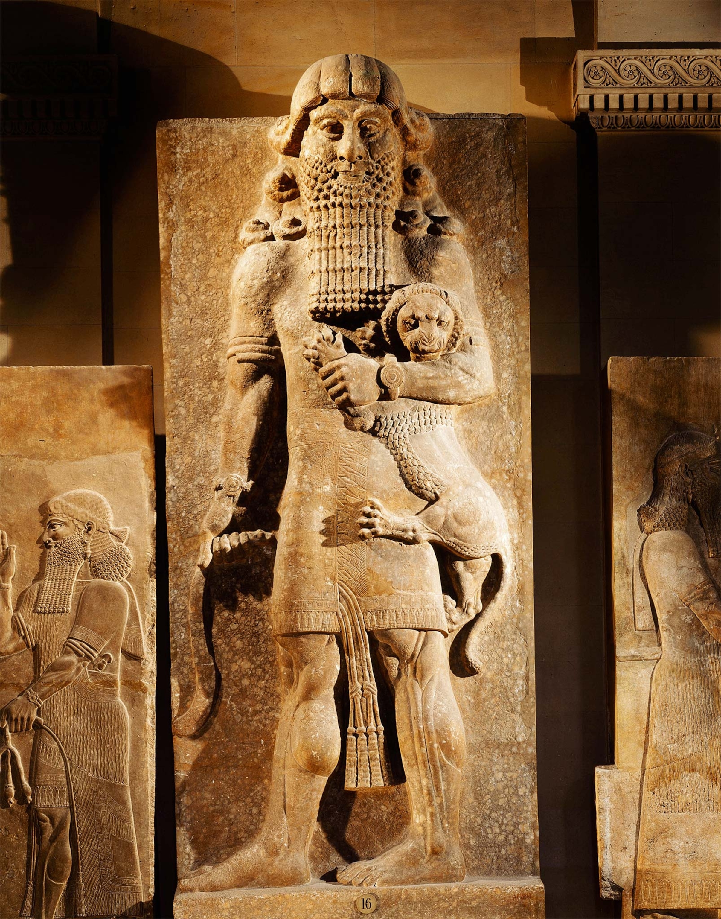 An Assyrian relief from the eighth century B.C. shows Gilgamesh, the legendary king of Uruk, holding a lion in his arms.