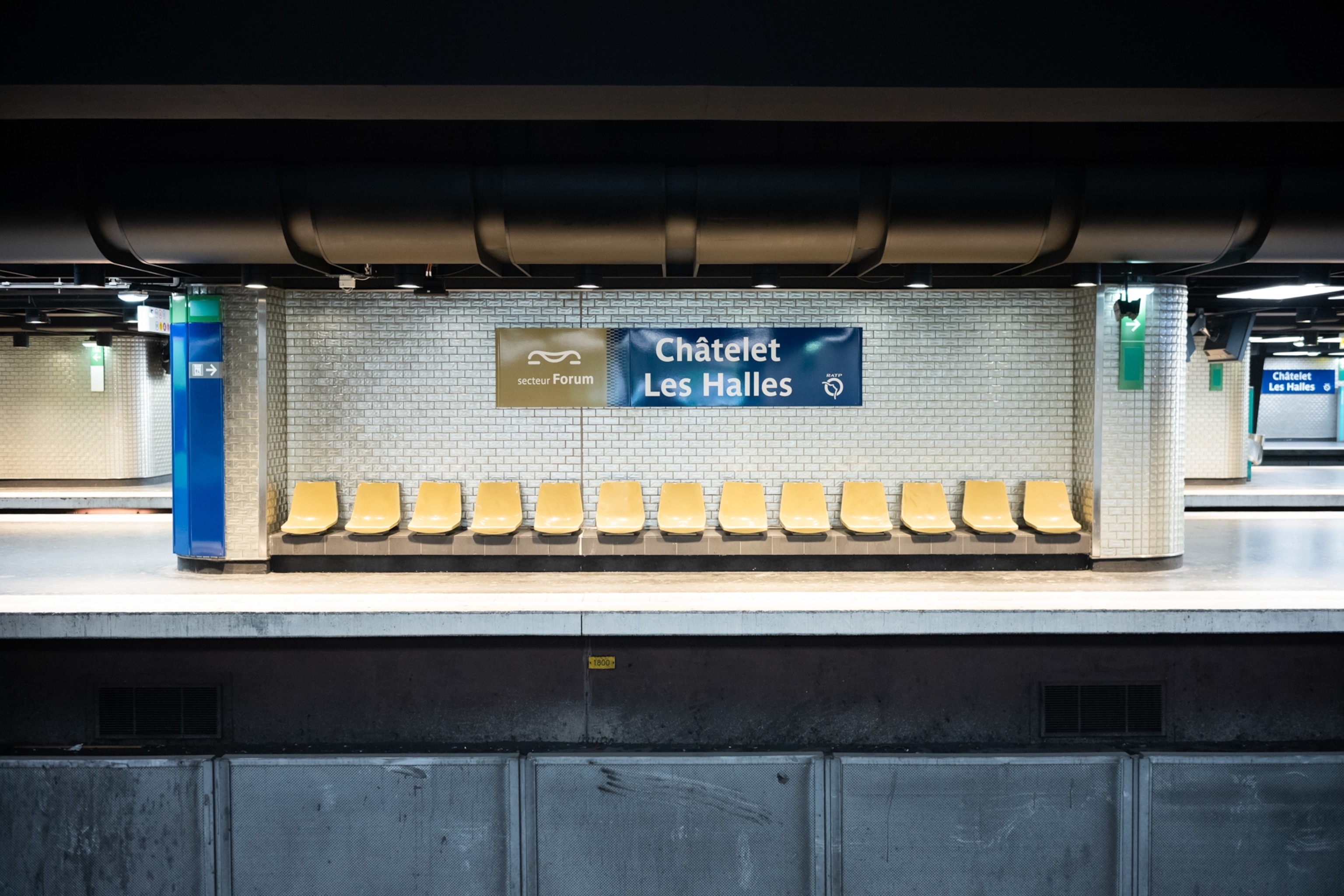 empty seats in the waiting section of an underground metro