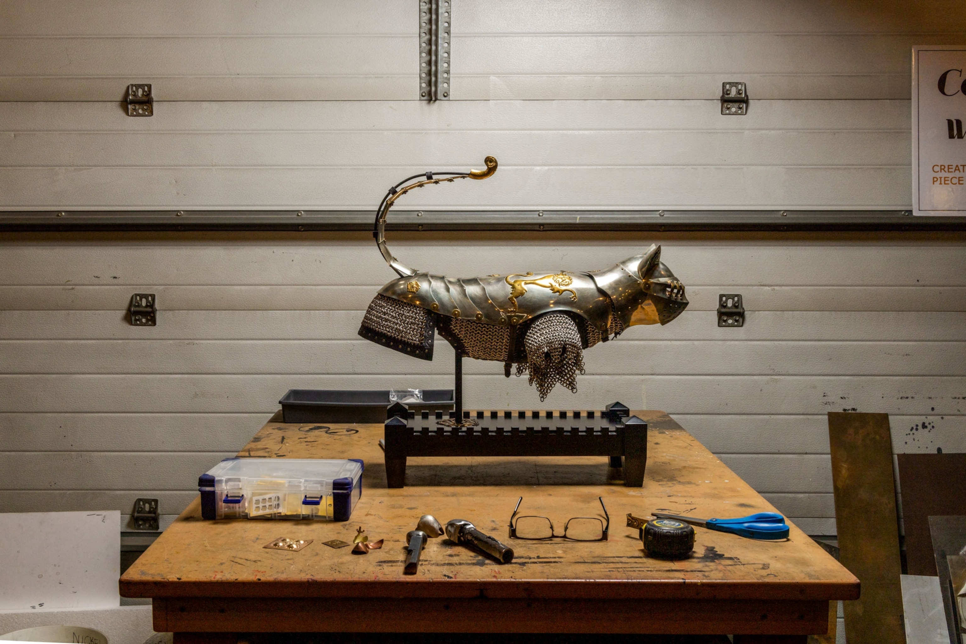 cat armor on a stand in a garage studio