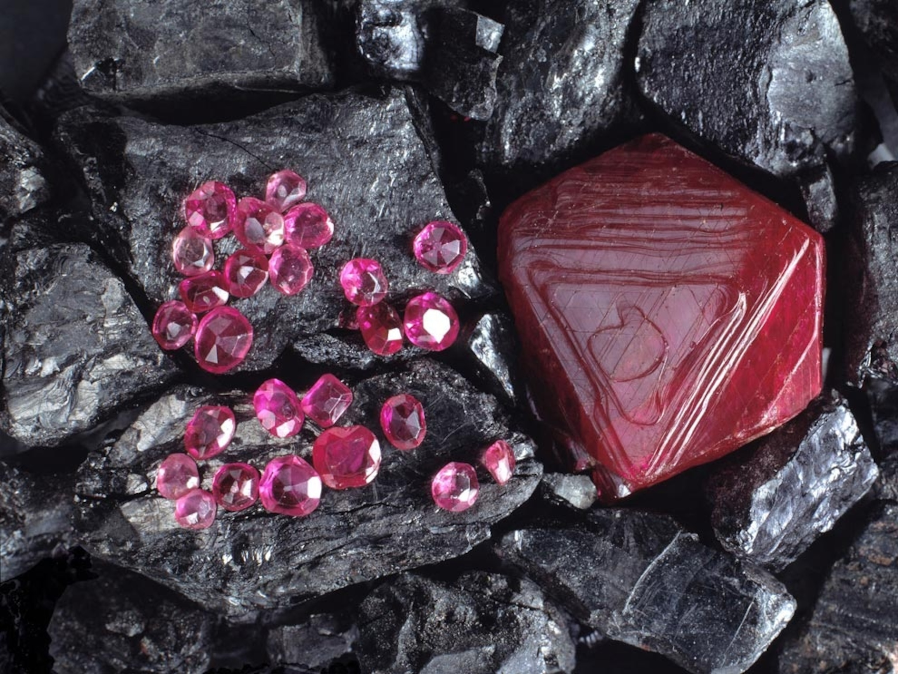 Rubies set against black rocks