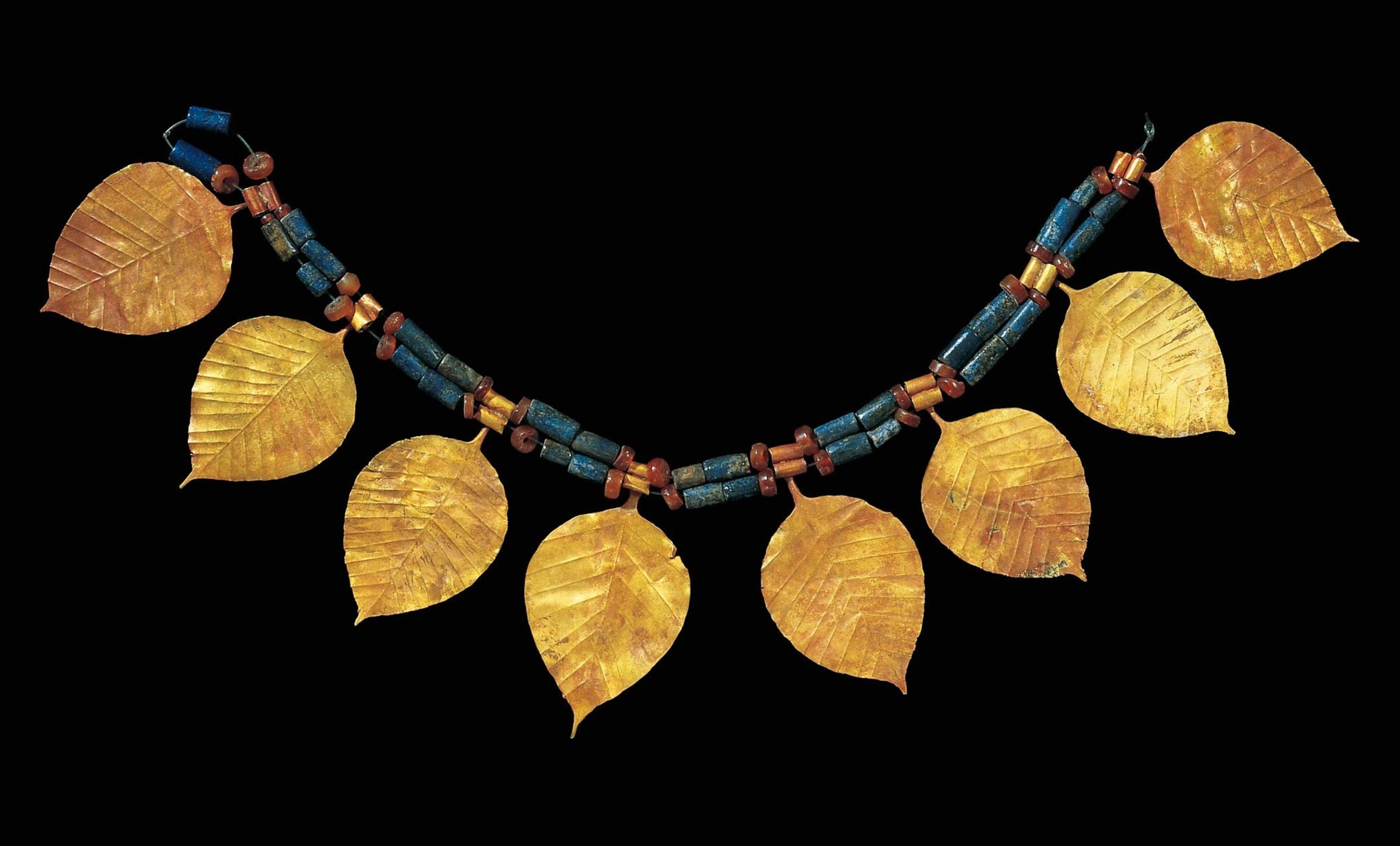 This choker of gold, lapis lazuli, and carnelian from circa 2450 B.C. was found in the tomb of Queen Puabi.