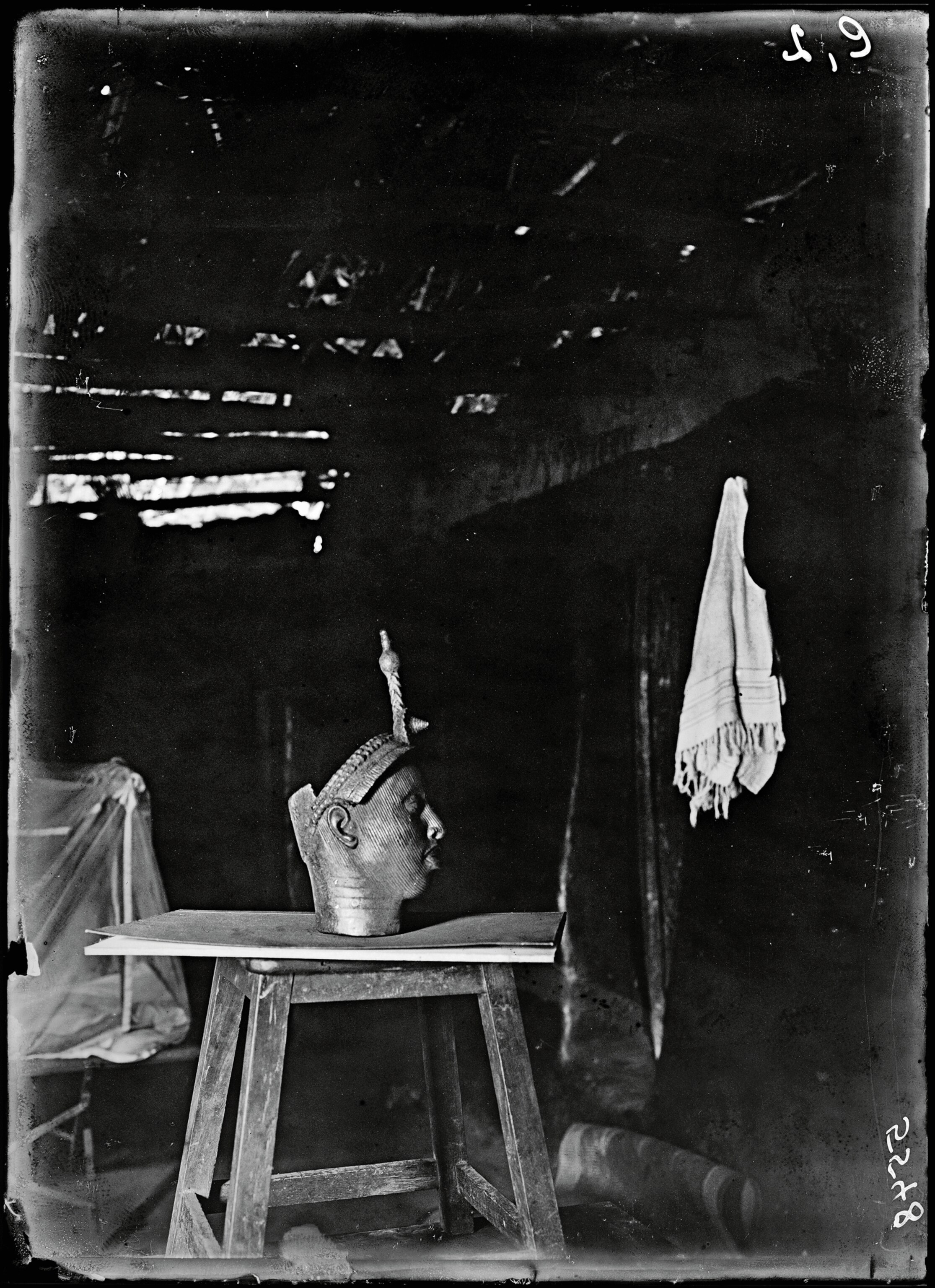 black and white image of the olokun head