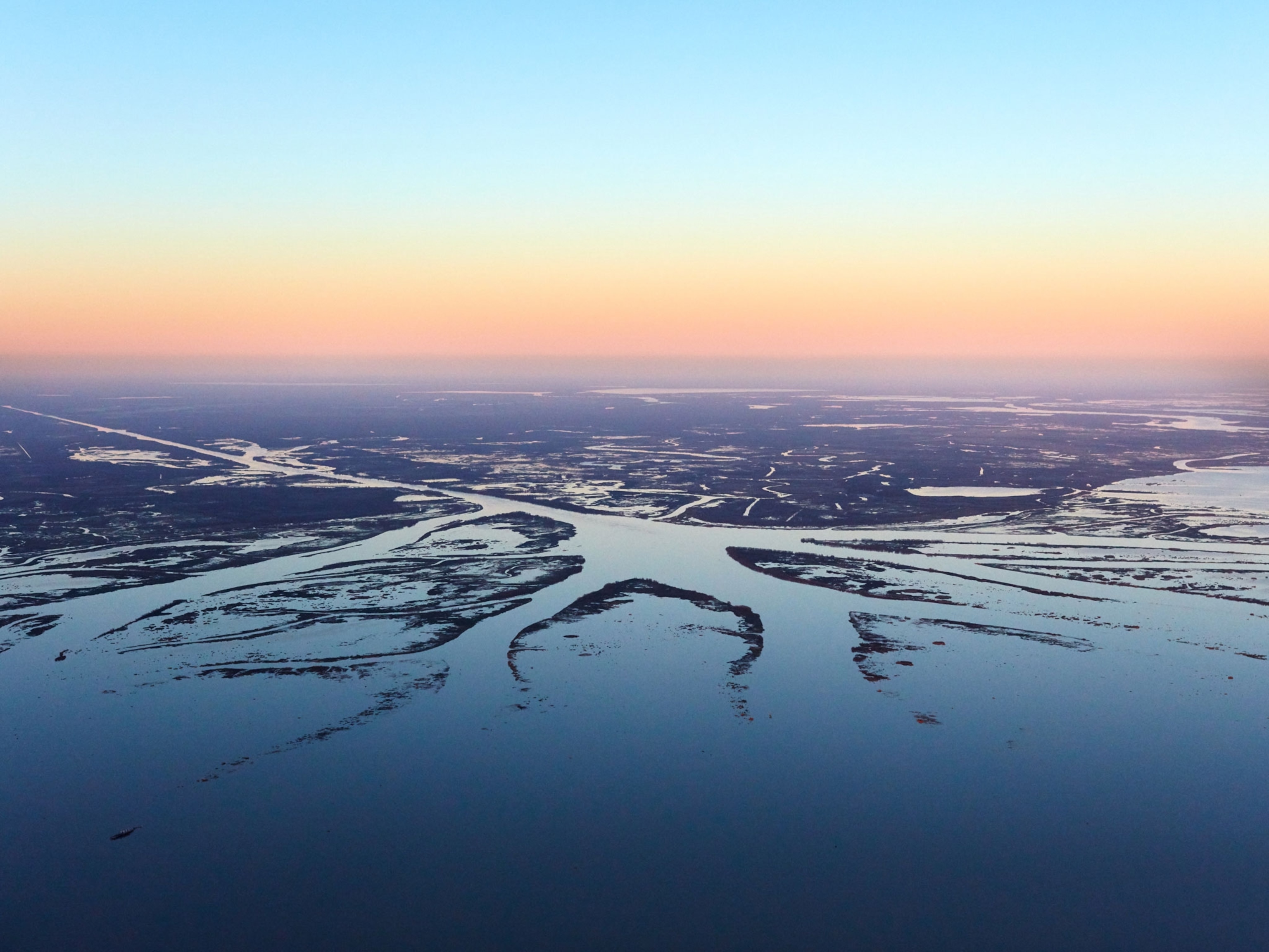 The Atchafalaya River, a distributary of the Mississippi, flows into the gulf