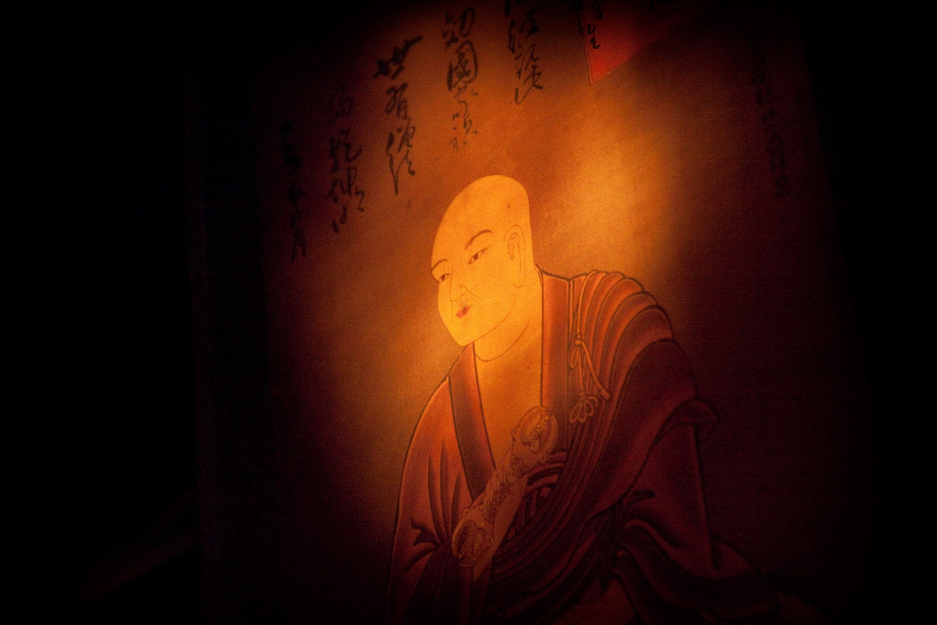 A spotlit painting of Kobo-daishi, or Kukai
