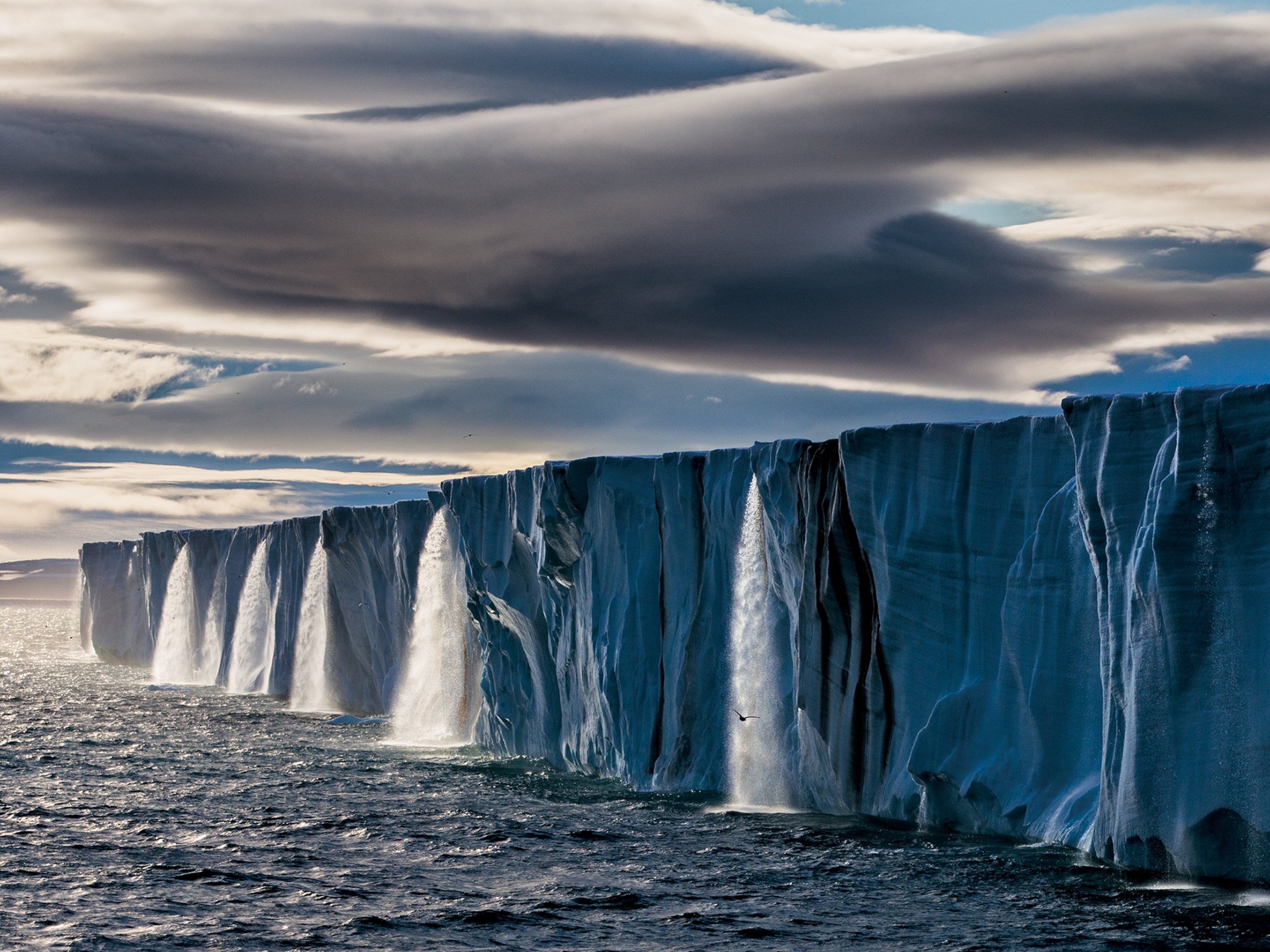 meltwater gushing from an ice cap on Nordaustlandet, Norway