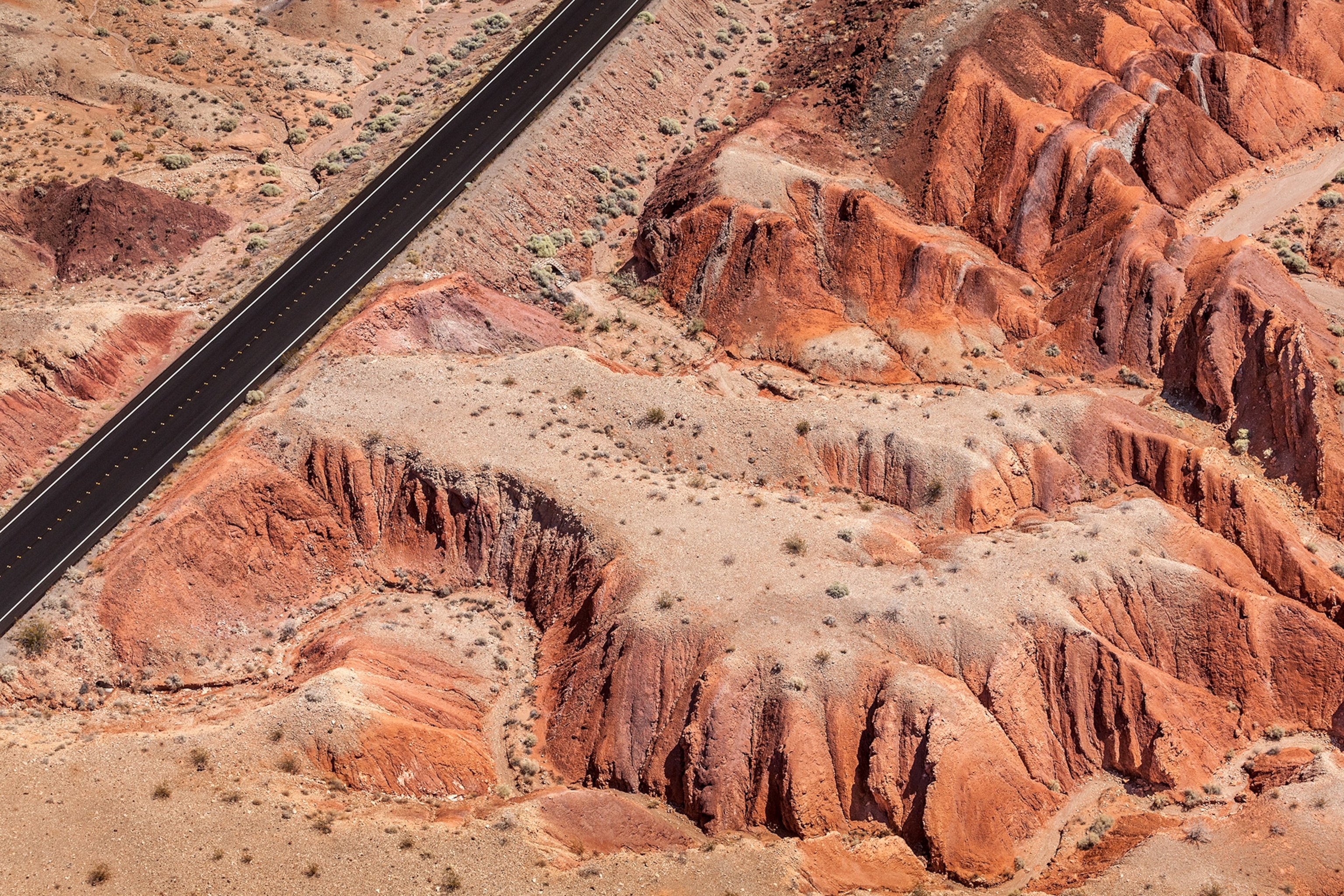 the landscape seen from the window seat of a plane over the Valley of Fire in Nevada