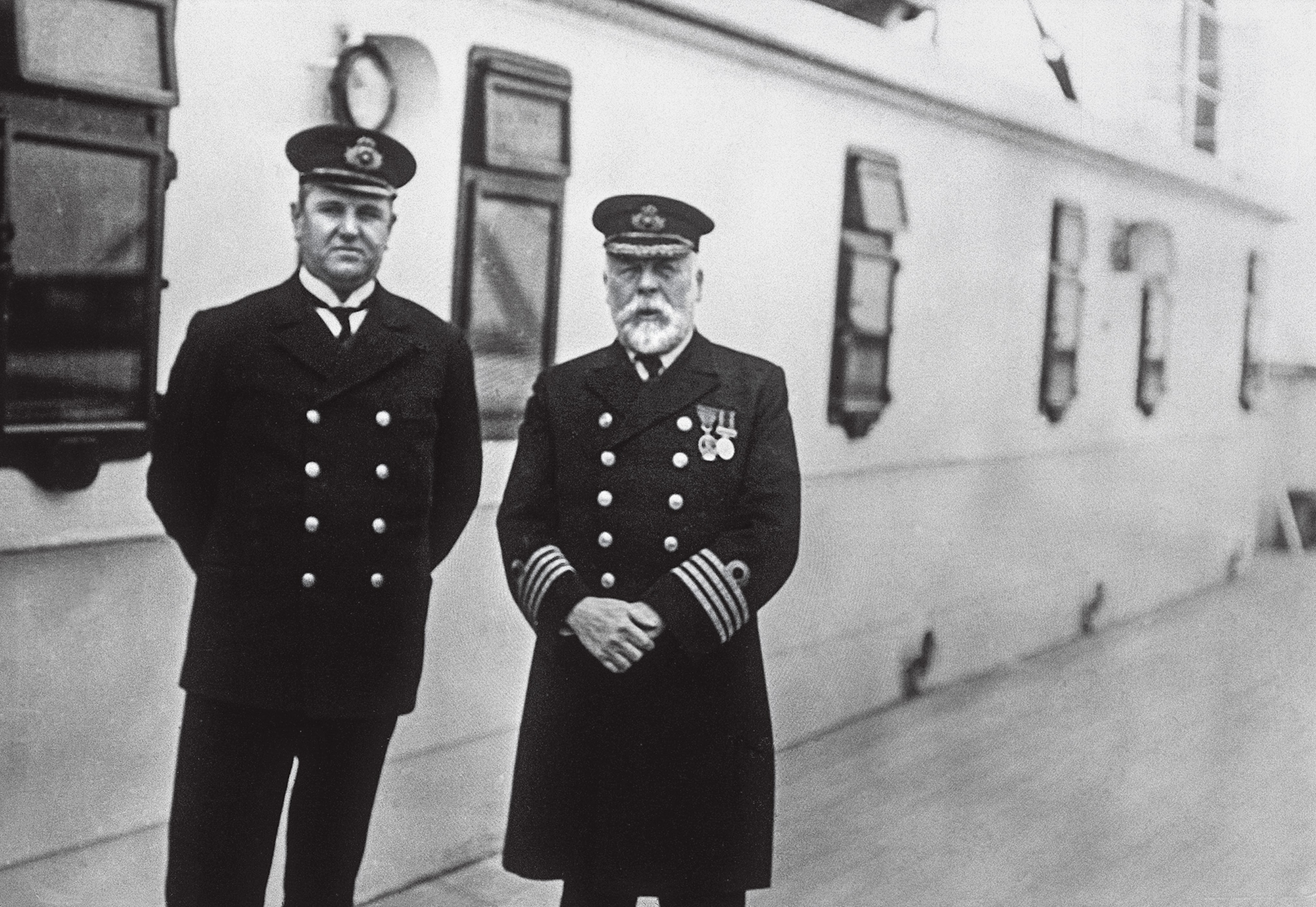 Captain Edward J. Smith (right) is shown here with the Titanic’s purser, Hugh Walter McElroy. The man who took the photograph was a passenger and departed the ship in Queenstown, Ireland, three days before the ship sank.